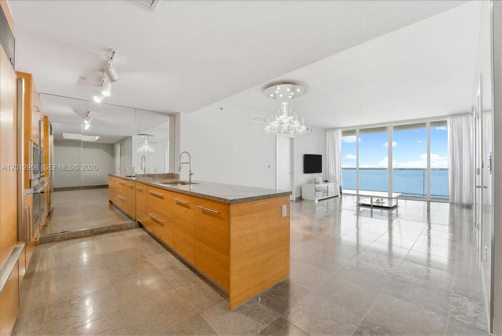 Beautful  residence offering unobstructed bay and city views from the 48th floor—with direct water views from every room. Floor-to-ceiling windows throughout maximize natural light and ensure consistent sightlines to Biscayne Bay from the living area and all bedrooms.
The layout is open and efficient, with a modern kitchen featuring sub zero and Wolf  appliances, ample storage, and a streamlined design that connects seamlessly to the main living space. 
Bedrooms are well-proportioned, each positioned to take full advantage of the water views, while the bathrooms offer clean, updated finishes designed for comfort and functionality. A private balcony extends the living space and provides an additional outdoor area to enjoy the bay.
The unit includes in-unit laundry and access to full-service amenities such as a resort-style pool, fitness center, spa, valet parking, and 24-hour concierge/security. 
Located in the heart of Brickell, the property is within walking distance to dining, shopping, and major business hubs, grocery stores. It has an adjacent park and boardwalk. Brickell City Center is across the street.