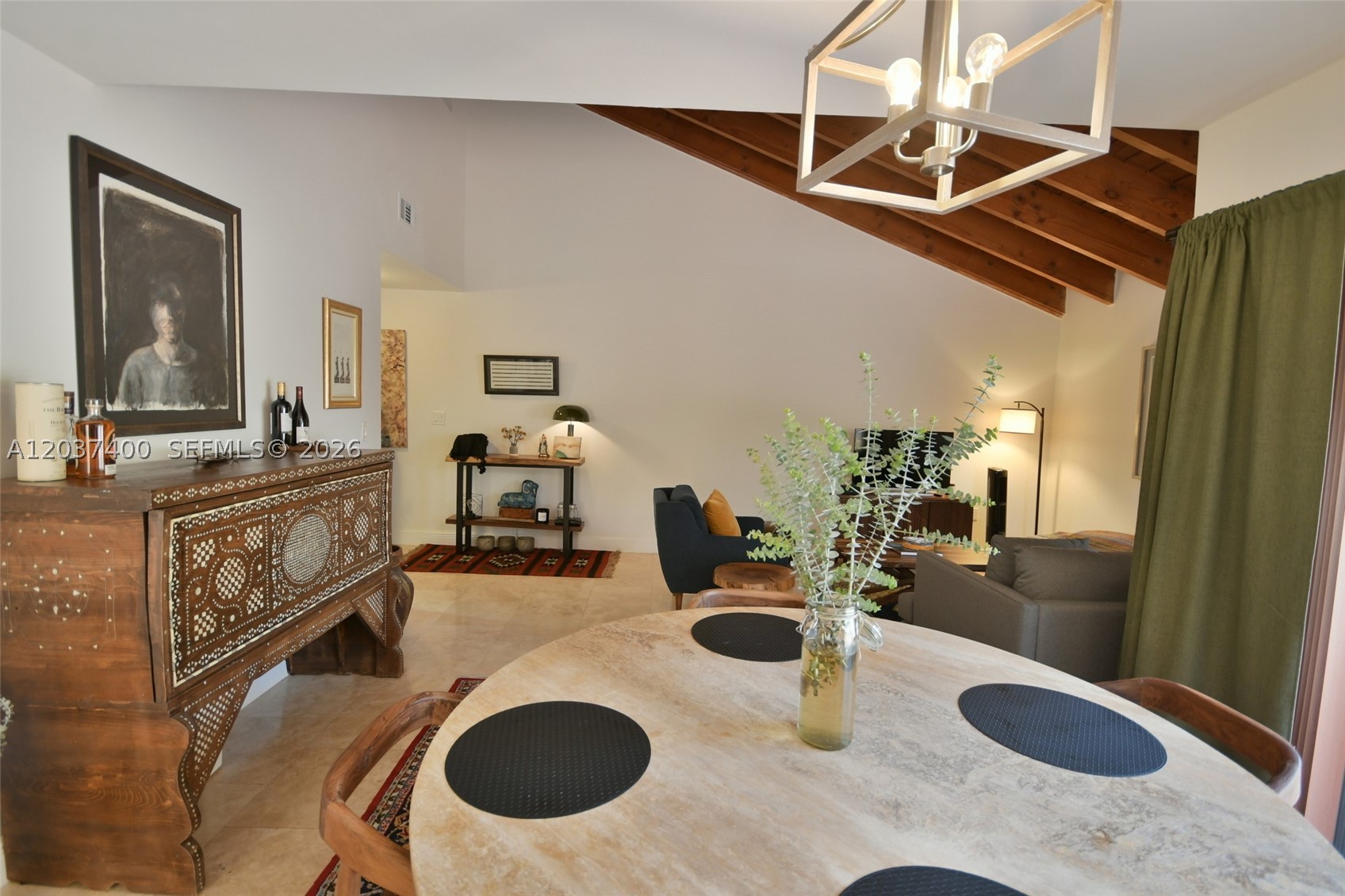 Nestled within the private, gated enclave of Briar Lake, this light-filled 3BR/2.5BA residence offers an exceptional lifestyle in one of Miami's most desirable locations. Soaring vaulted wood-beam ceilings and expansive windows fill the living spaces with natural light, while travertine flooring and glass doors enhance the home's timeless appeal. The thoughtfully designed floor plan features a first-floor primary suite for added comfort and privacy, spacious bedrooms with wood flooring, and an indoor laundry room. The kitchen is appointed with granite countertops, abundant cabinetry, and an inviting layout ideal for everyday living and entertaining. Enjoy seamless indoor-outdoor living with a private patio perfect for relaxing or hosting guests. Ideally situated near top-rated Vineland K-8 Center and Palmetto Elem, Middle and High Schools, The Falls, Life Time Fitness, premier shopping, boutiques, dining, and entertainment, this residence presents a rare opportunity to enjoy comfort, convenience, and an exceptional neighborhood setting.