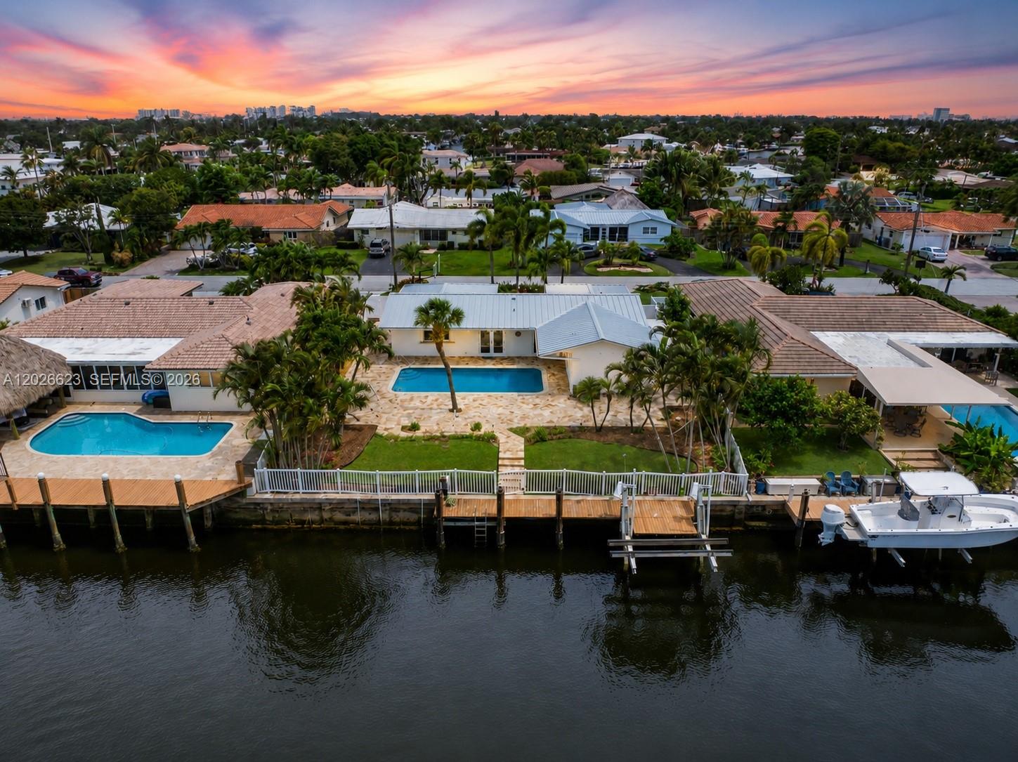 Discover this absolute gem in the quiet, NO-HOA community of High Ridge Estates. This adorable and well-cared-for home sits on an oversized 9,000 sq. ft. lot with 75 feet of navigable canal frontage, making it the perfect spot for families who love the water. Enjoy a 75-foot private dock with a smooth route to the Intracoastal and only one fixed bridge (approx. 10.9’ clearance) ideal for family center consoles and pontoons.

The backyard is a private retreat. A premium marble-paver deck surrounds the in-ground pool, leading to an expansive covered patio designed for effortless entertaining. The yard is fully fenced for privacy and safety, complete with professional lighting and two permanent, anchored storage sheds for gear.

Inside, the bright layout features Impact Glass Doors and a clean kitchen with a built-in wine fridge. High-value infrastructure updates offer total peace of mind and insurance savings, including a 2017 Metal Roof, a newer high-efficiency AC, and an updated electrical panel.

This location is incredible for families, minutes from the A-rated McNab Elementary and elite private schools like Pine Crest, Westminster Academy, and St. Thomas Aquinas. With no HOA and proximity to Pompano’s best parks and beaches, this move-in-ready home is a rare find.