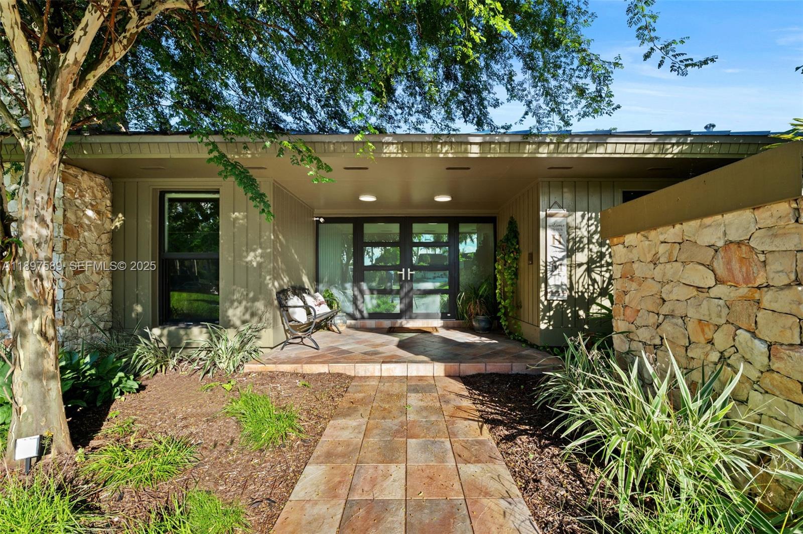 Tucked away on a private cul-de-sac in Pine Bay Estates, this updated 5-bedroom, 4-bathroom home sits on an expansive lot, offering privacy and comfort in one of Palmetto Bay's most desirable neighborhoods. Surrounded by lush greenery, the property features avocado and mango trees, creating a tranquil backyard oasis complete with an enclosed pool deck & summer kitchen—ideal for relaxing or entertaining year-round. Inside, you’ll find spacious, light-filled living areas, an updated kitchen, & a flexible floor plan designed to suit both everyday living and special gatherings. The home is equipped with impact windows & doors and a new roof, installed in 2023. Enjoy the serenity and privacy of this tucked-away location while remaining just minutes from top-rated schools, parks, dining, & more.