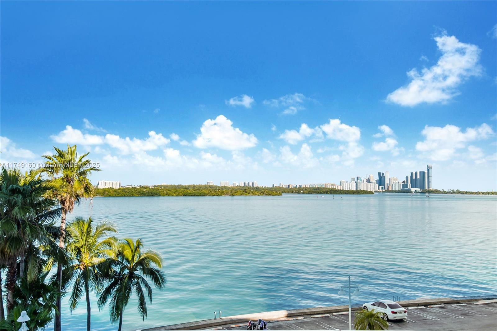 Stunning Bay Harbor Island Condo with Bay & Skyline Views. Fully remodeled 1-bedroom + den with Travertine marble floors throughout and a tiled balcony. The open-concept kitchen features updated cabinetry, countertops, and high-end appliances. A versatile den space is perfect for a home office or guest area. In-unit washer/dryer for added convenience. The building offers resort-style amenities, including a heated waterfront pool, fitness center, clubhouse, library, game room, BBQ area, and 24/7 front desk. Enjoy a walkable lifestyle near Bal Harbour Shops, parks, dining, and top-rated A+ schools. Just minutes from the beach! Live, Work and Play here.