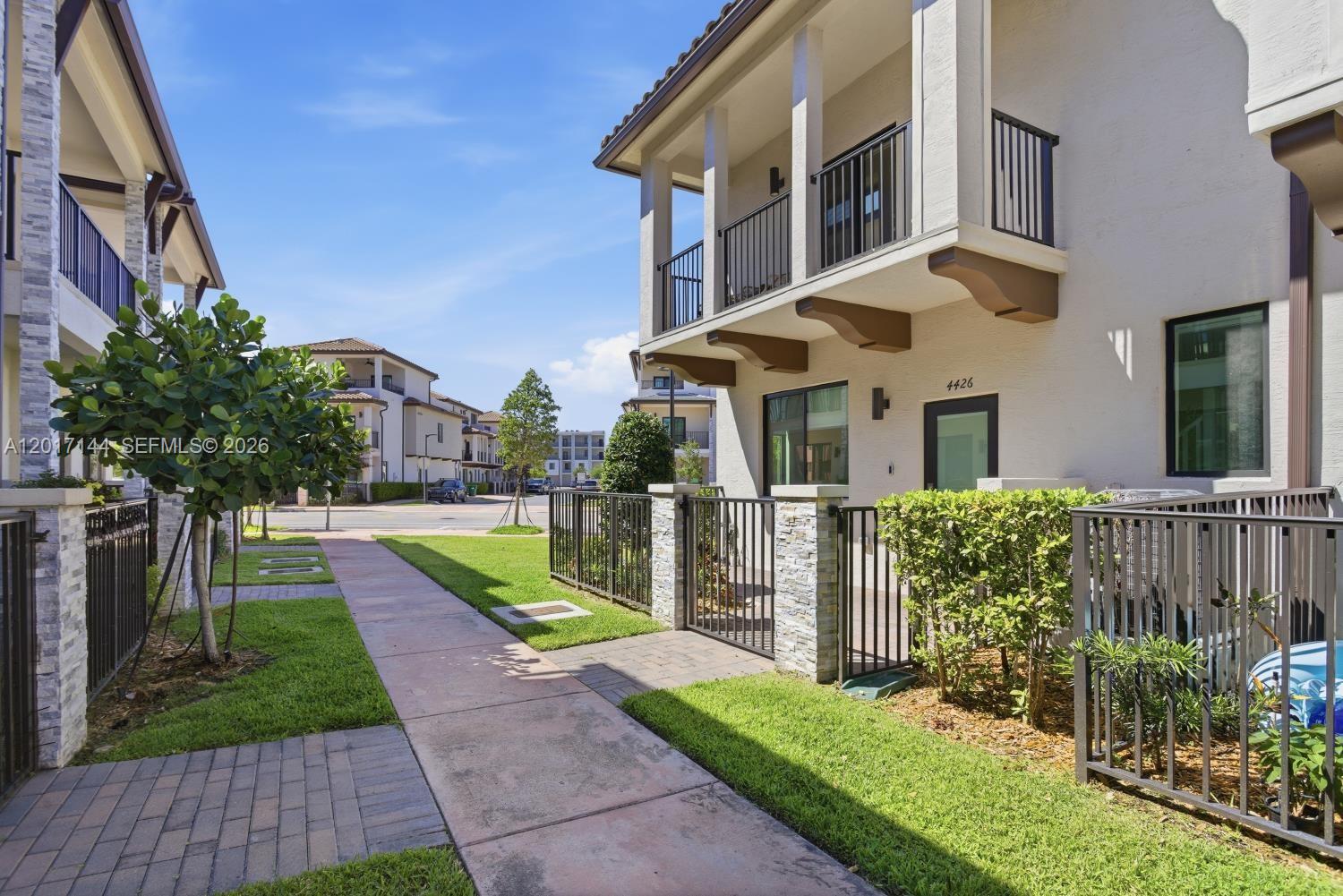 Corner 3-level townhouse in the highly desirable Urbana at Downtown Doral, offering modern luxury living in a prime location in the heart of Downtown Doral. This residence features a bright open-concept first floor with a contemporary kitchen, quartz countertops, and stainless-steel appliances, ideal for both everyday living and entertaining. The second floor offers a spacious primary suite with his-and-her walk-in closets, along with two additional bedrooms that share a full bathroom, plus a convenient full-size washer and dryer. The home is filled with natural light, high ceilings, and excellent cross ventilation throughout, enhancing the open and airy feel. Multiple outdoor spaces include balconies and two large terraces. The top floor features a spacious terrace with a built-in BBQ area, perfect for entertaining and enjoying sunset views. Residents enjoy exclusive access to Urbana’s resort-style amenities, including a pool, spa/jacuzzi, state-of-the-art fitness center, indoor basketball court, and children’s splash pad, providing a complete lifestyle experience in one of Doral’s most vibrant communities.