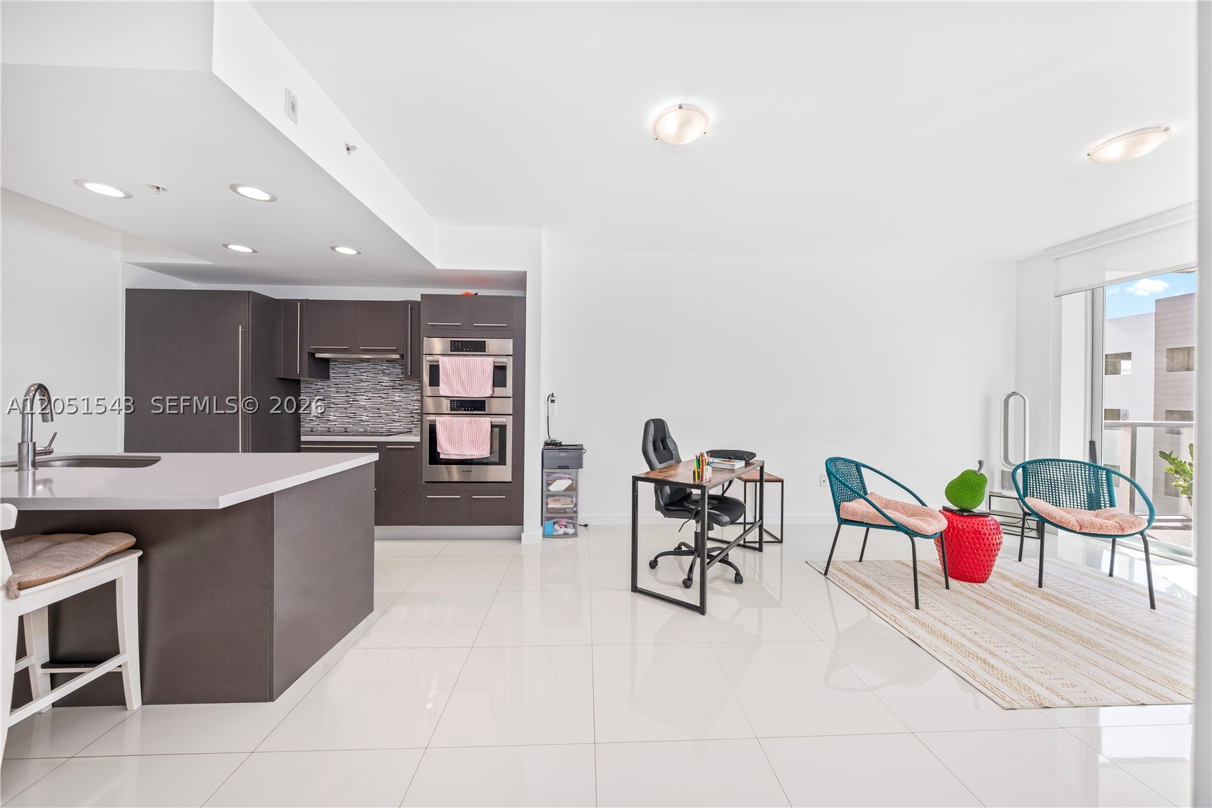 Discover an exceptional opportunity to own a beautiful apartment in the heart of Doral. This spacious 1-bedroom plus den, 2-bathroom residence features soaring ceilings, elegant contemporary finishes, and a thoughtfully designed open-concept layout that suits modern living. The den offers flexible use as a home office or guest space, enhancing both comfort and value. The gourmet kitchen is equipped with premium appliances and sleek cabinetry, ideal for everyday living. Residents enjoy resort-style amenities including a state-of-the-art fitness center, resort-style pool, sauna, and clubhouse—elevating lifestyle. One assigned parking and a prime location near top-rated schools, this property offers the perfect combination of urban convenience, lifestyle, and long-term value.