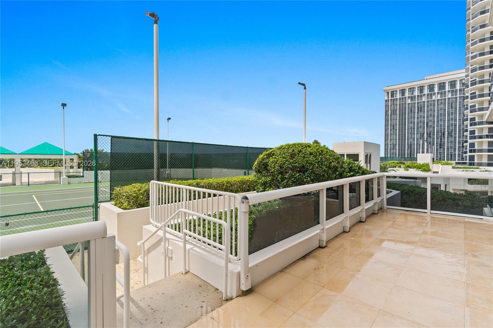 Rarely on the market, this split floor plan lowest priced 2-bedroom, 2-bath corner residence at the Green Diamond is on the 5th floor. Offers a truly unique feature—a huge wraparound terrace larger than those on higher floors. The light-filled home has brand-new flooring, stovetop, and water heater, complemented by floor-to-ceiling windows. The bright eat in kitchen has granite counter tops with dual sinks. A spacious en-suite primary bedroom has a large walk in closet and a marble bathroom with a jacuzzi tub and dual sinks. The 2nd bedroom also has a connecting marble bathroom and washer/dryer. With its bright, airy ambiance and exceptional indoor-outdoor flow, this residence presents a one-of-a-kind living experience. Building offers 1st class amenities: 24hr. security, valet, concierge, tennis court, pool, gym, free classes-yoga, Pilates, aerobics & Zumba, café/market, 16,000SF oceanside club & spa, steam rooms, saunas, indoor/outdoor hot tubs & massage therapists. Please click the virtual tour link to see a video of the property.