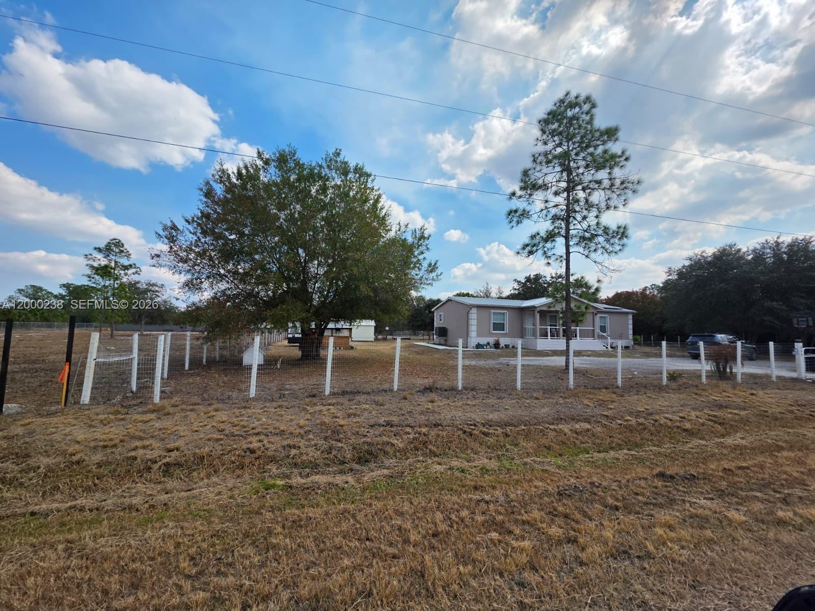 Spacious 3-bedroom, 2-bath manufactured home on approximately 1.25 acres in Montura Ranch. Enjoy privacy, open space, and country-style living just minutes from Clewiston. This property offers plenty of room for parking trucks, trailers, or equipment, making it ideal for tenants needing space and flexibility. No HOA restrictions. Features well water and septic system. Convenient access to major roads while maintaining a quiet rural setting. Available for immediate occupancy. Easy to show.