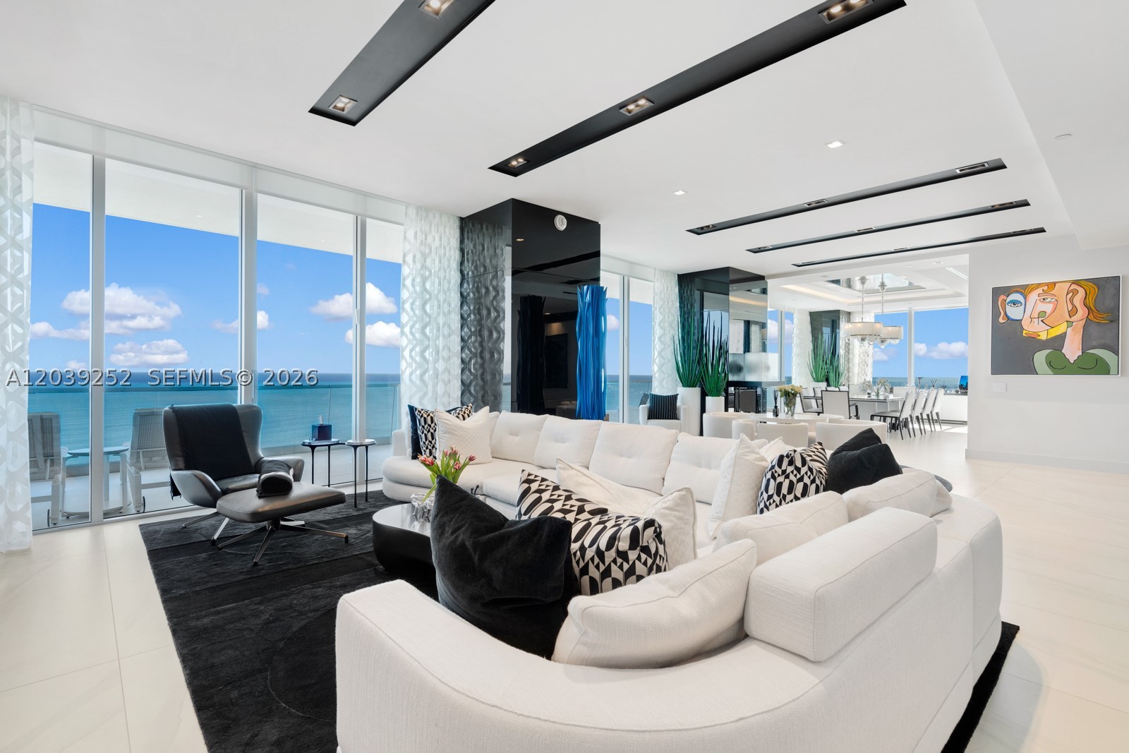 A penthouse space without the penthouse price! This truly exceptional residence features nearly 7000SF of interior space and a 1500SF wrap around terrace with views of the ocean, intracoastal, and city skyline. At nearly 80ft wide, it's wider than many homes and penthouses, and boasts 11-foot vaulted ceilings lending to an even grander feel. Completely customized and meticulously designed with state-of-the-art finishes and equipment, no detail has been overlooked. The spaces are all impressive in size with a large great room for entertaining, a formal dining area, spacious primary suite with dual wardrobes and bathrooms, 4 guest bedrooms, a family room / office, and a home theater. The building offers an unmatched five-star lifestyle and features a 70,000SF sky club occupying three upper floors of the tower, two restaurants plus DRIP cafe, state-of-the-art spa and fitness complete with treatment rooms and a hair and nail salon, a cinema, dog areas and a lot more! Cabana may be purchased separately.