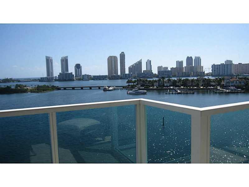 RESORT LIFE STYLE AT PENINSULA I , FABULOUS OVERSIZED 2 BEDROOMS PLUS DEN AND 2.5 BATHROOMS, LARGE LIVING ROOM WITH A MAGNIFICENT WATER VIEW, GOURMET KITCHEN ,CROWN MOULDINGS THROUGHOUT,  MARBLE FLOORS, PRIVATE ELEVATORS, AND PRIVATE FOYER, 2 PARKING SPAC ES,UNIT WAS BARELY USED AS A SECOND HOME, IN EXCELLENT CONDITION INCLUDES GYM, POOLS, SPA, TENNIS COURT. THE UNIT IS ALSO AVAILABLE FURNISHED.