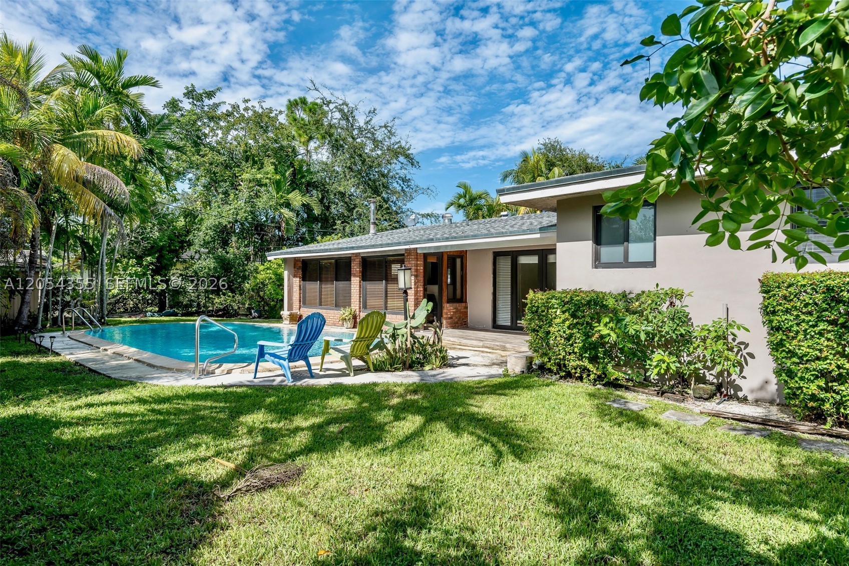 4-bedroom, 2-bathroom Mid-Century Modern pool home, exuding warmth and brightness. Its open concept design seamlessly connects with nature through natural terrazzo floors, wood, and brick elements. The home offers impact windows, a modern kitchen, quartz countertops, and remodeled bathrooms. With an alarm system, security cameras, and a newish roof, peace of mind is guaranteed. Nestled on a serene street near Continental Park and within walking distance to Kenwood Elementary, it enjoys a prime location between Baptist Hospital, Dadeland Mall, and Palmetto Expressway. Rent includes monthly professional pool service, making it a true oasis of comfort and convenience.