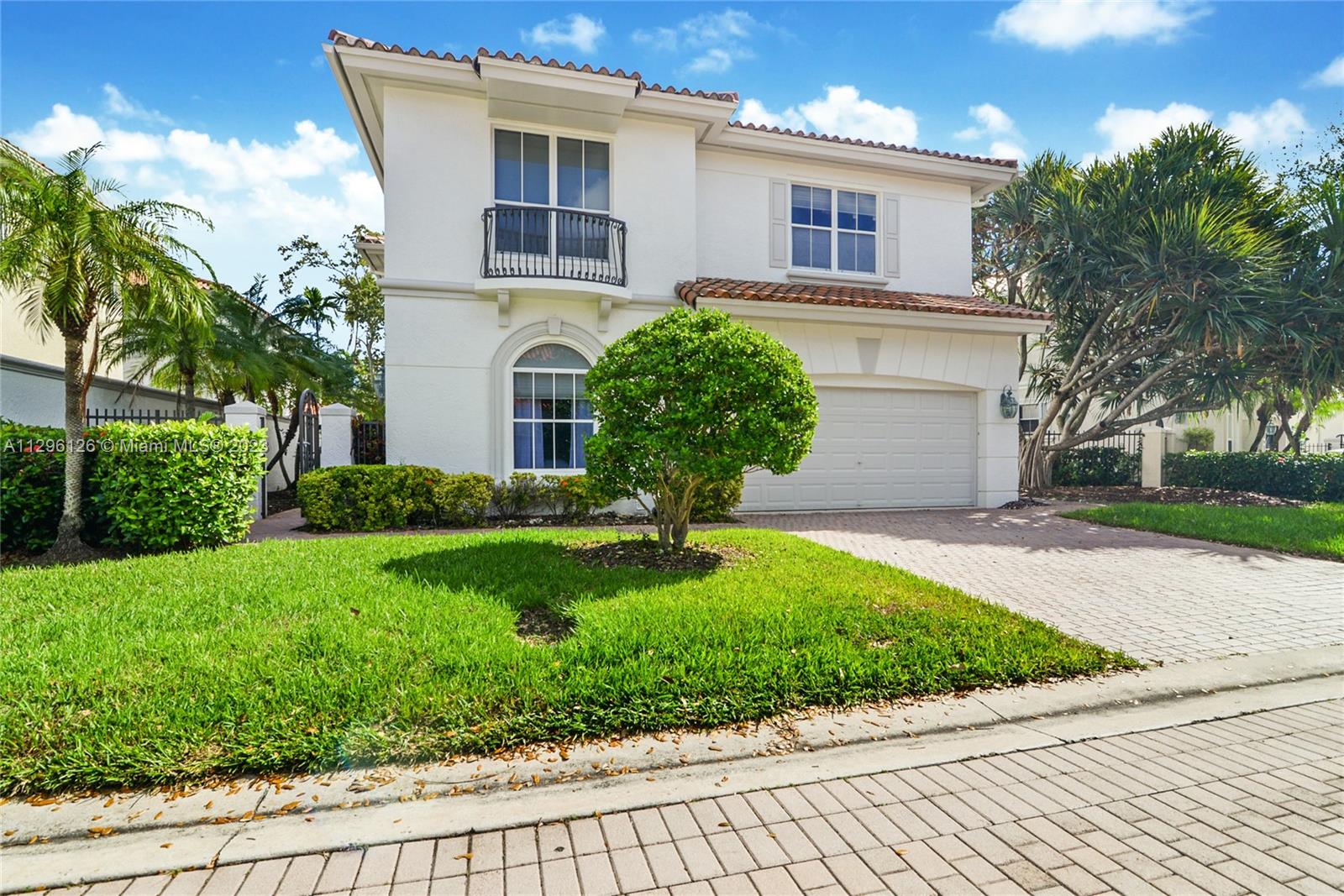 Remodeled and Impeccable home with 3 spacious bedrooms upstairs and 1 bedroom downstairs. Super Bright. Great entertaining patio area with pool. A lot of storage closets, 2 car parking garage. Located at the prestige Harbor Island Gated Community with great amenities that include tennis court, Spa, Gym, 20 acre park with children's play area and Marina. Just off the Intercostal. It wont last long.