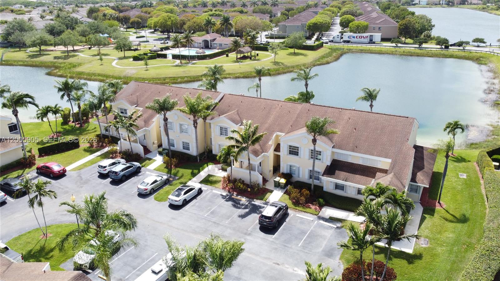 Welcome to this beautifully maintained 2-bedroom, 2-bath upstairs condo in the desirable Keys Gate community. Enter through a welcoming foyer that opens to a bright and spacious living and dining area with elegant tile flooring and a chandelier, creating the perfect setting for entertaining or relaxing. The primary suite features comfortable carpeting, a ceiling fan with light, window blinds, and sliding glass doors leading to the screened patio. The en-suite bath includes a walk-in closet, one vanity, and walk-in shower. A generously sized second bedroom offers carpet flooring, double-door entry, window blinds, ceiling light, and its own walk-in closet. The second bathroom includes a convenient tub/shower combination with a one vanity. The eat-in kitchen is bright and functional with blinds, a double sink with window view, and appliances including refrigerator, dishwasher, stove, and microwave, plus a pantry for additional storage. PROOF OF FUNDS AND/OR PRE-APPROVAL LETTER REQUIRED PRIOR TO SCHEDULING A SHOWING OF THE PROPERTY.