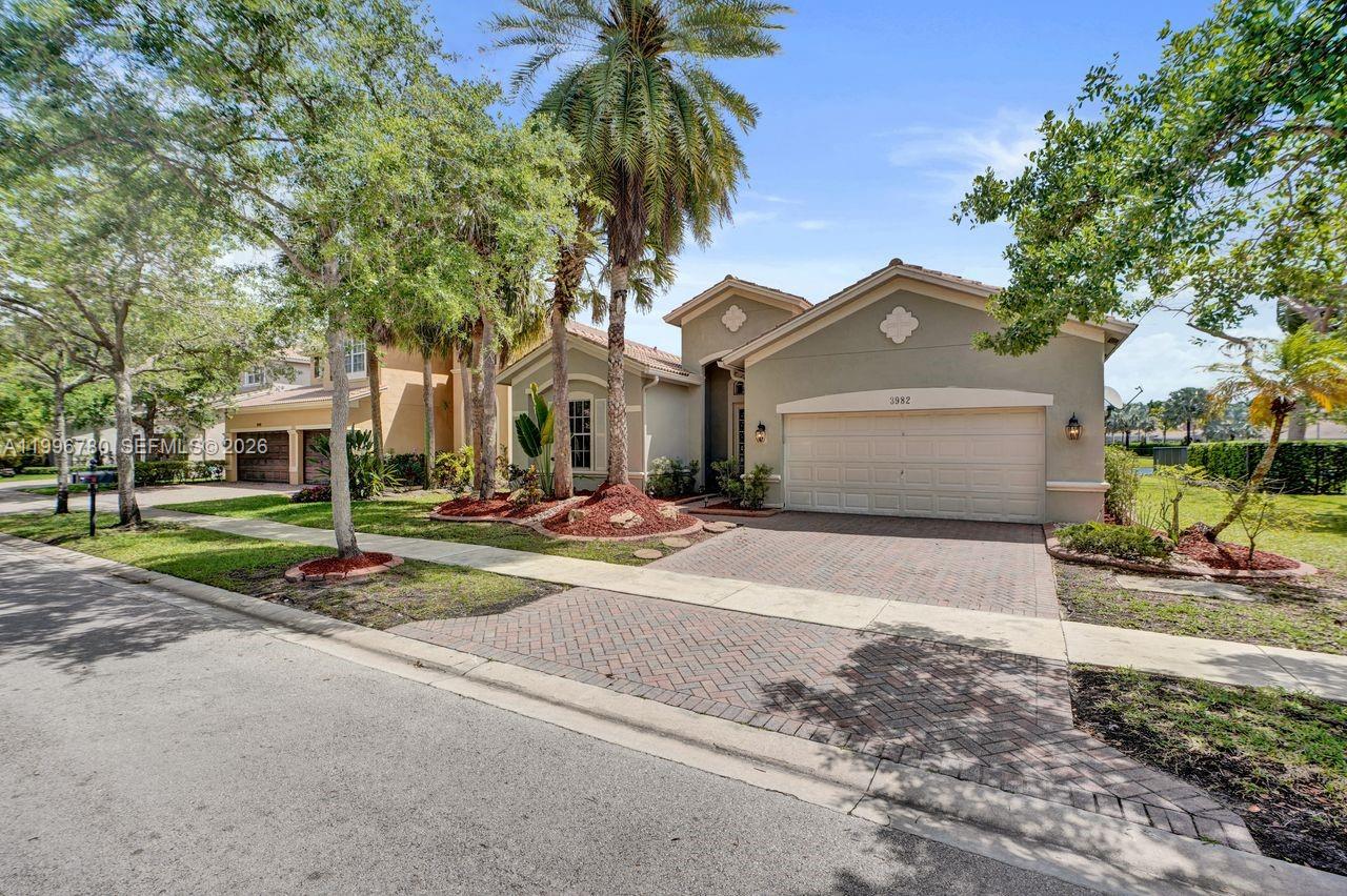 This is a beautiful and popular Whitewater model with 4 bedrooms and 3 baths and almost 2500 sf living area. Great property with wide traquil lakeviews and room for a pool. Home shows great with neutral tile flooring, updated bathrooms and kitchen with white cabinets, stainless steel appliances and granite countertops. Nicely updated bathrooms and newer AC. Large covered patio to enjoy the beautiful lakeviews with friends and family. Great amenities with state of the art fitness, club house, resort style community pool, playground, beach volley and more. Close to the best schools Weston has to offer!