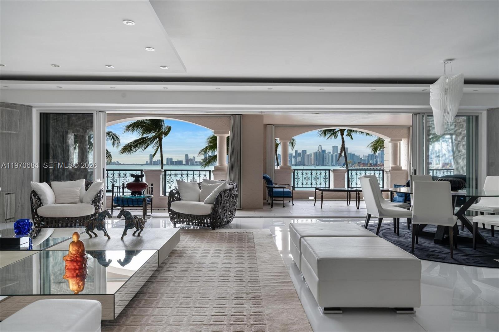 Experience the ultimate in private island living at 5322 Fisher Island Dr, Unit 5322, Miami Beach, FL 33109. Located within the exclusive Bayview community on Fisher Island, this expansive 6,300 SF interior residence offers breathtaking direct views of Biscayne Bay and the Miami skyline  ?.

Spanning approximately 6,300 square feet of interior living space plus an estimated 1,800 to 2,000 square feet of wraparound covered terraces, this residence lives like a single family waterfront home in the sky. The layout offers 4 spacious bedrooms, 4 full bathrooms, plus a powder room and a dedicated office that can easily function as a fifth bedroom, media room, or private study.

Floor to ceiling sliding glass doors open to oversized terraces designed for true indoor outdoor living. The expansive covered outdoor areas provide multiple seating and dining spaces, all framed by sweeping water views and the iconic Miami skyline.

The grand living and dining areas offer exceptional scale, high ceilings, and abundant natural light. The primary suite is a private retreat with direct terrace access, generous closet space, and a spa style bath. Each additional bedroom is well proportioned and features en suite privacy.

Fisher Island residents enjoy unparalleled amenities including private beach club, golf course, tennis, marinas, fine dining, spa, and 24 hour security. Accessible only by ferry or private yacht, this is one of the most exclusive residential communities in the country.