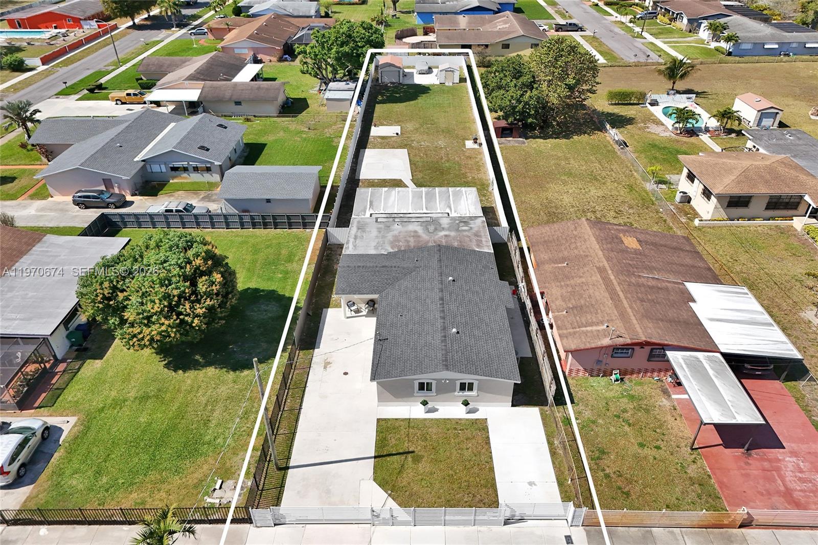 Welcome to this spacious and well-designed single-family home located at 17110 NW 19th Ave in the heart of Miami Gardens. Offering 2,040 sq. ft. of living space, this residence features 5 bedrooms, 3.5 bathrooms, and a functional layout ideal for comfortable living and entertaining. Northern exposure fills the home with natural light throughout the day. Situated on an expansive 15,397 sq. ft. lot, the fully fenced front and backyard provide privacy and ample outdoor space. Additional highlights include an extended driveway, a covered rear patio, two storage sheds, impact windows and doors, roof replaced in 2022, and an electric fence. Plenty of room to relax, entertain, or create your own outdoor retreat. Conveniently located near major roadways, shopping, and dining. Schedule your private showing today.