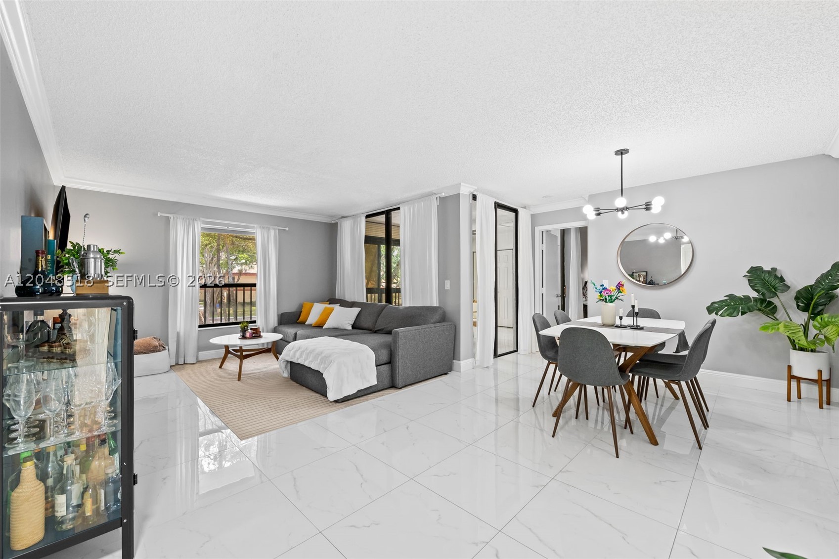Experience modern elegance in this stunningly reimagined 2 bedroom, 2 bathroom condo in the heart of The Township. Completely transformed with a top-to-bottom remodel, this home balances sophisticated style with everyday comfort. The open-concept living space is bathed in natural light, showcasing sleek flooring and contemporary finishes that flow seamlessly into a large designer kitchen. Both bathrooms have been upgraded into spa-like retreats, ensuring every inch of this home feels fresh and turnkey.

Living here means enjoying a resort-style lifestyle with access to a premier suite of amenities. Whether you're relaxing by the pool or exploring the lush surroundings of The Township, the community offers endless ways to unwind, and enjoy. Perfectly positioned in a central Coconut Creek location, you are just minutes away from the area's best shopping, dining, and entertainment. This is a rare opportunity to move right in and enjoy a vibrant South Florida lifestyle.
