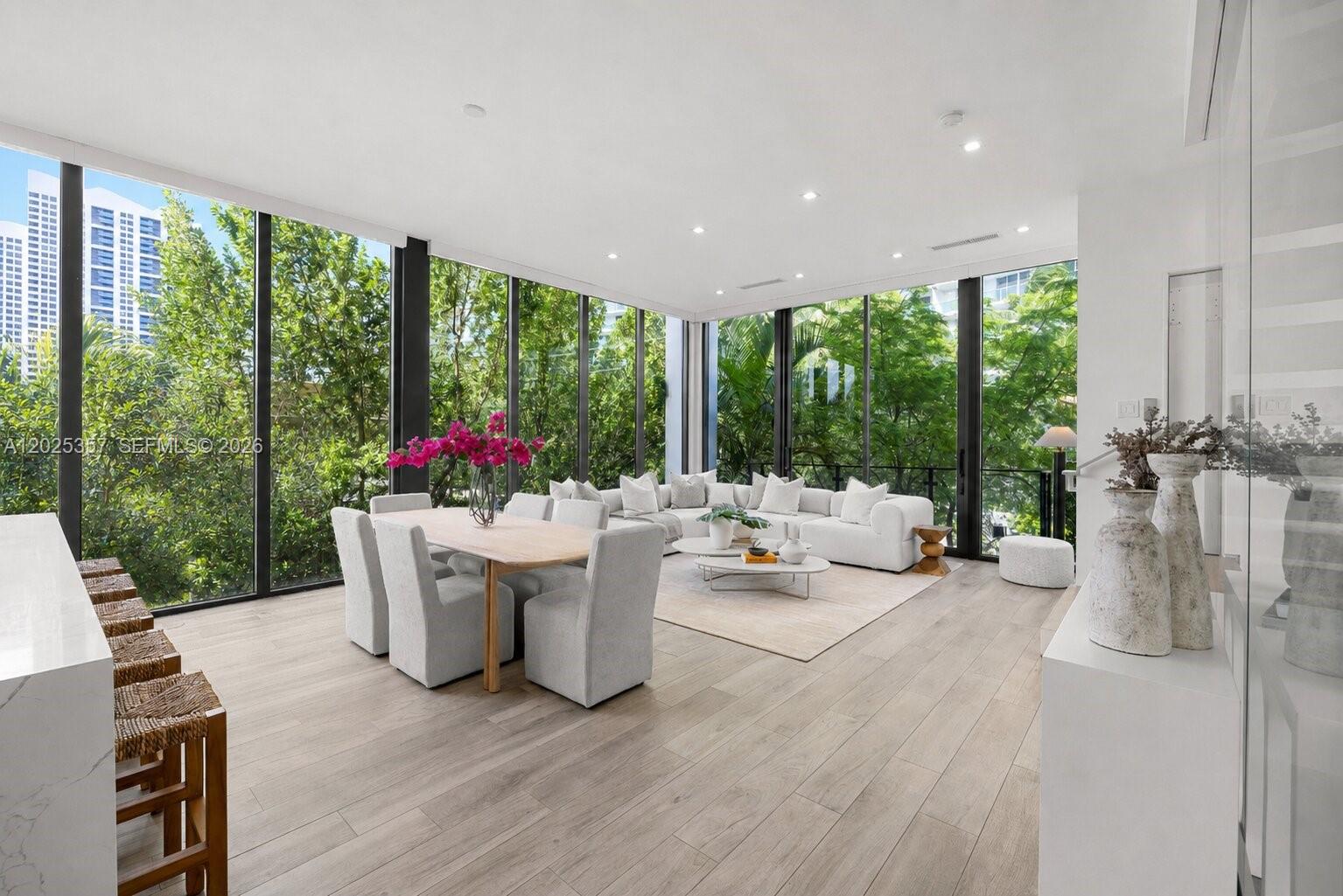 Beautifully designed and built in 2018, this one-of-three modern townhomes within an exclusive boutique building is ideally situated in one of the best walkable locations in South Beach. Spanning 2,229 SF across three levels, the 3-bedroom, 3.5-bath residence features soaring 11-foot ceilings, a private elevator, a floating glass-enclosed staircase, and a gated 2-car garage with direct private access into the home. The private rooftop oasis is a rare South Beach offering, complete with a plunge pool and expansive lounging and dining areas, ideal for entertaining or enjoying all-day sun. Interior highlights include custom cabinetry and closets throughout, premium appliances and fixtures, a wine fridge, dual ovens, and an in-unit washer and dryer. The expansive primary suite features a walk-in closet, dual vanities, and a separate soaking tub and glass-enclosed shower. Just moments from the beach, Pura Vida, Sunset Harbour, Lincoln Road, and some of Miami Beach’s best restaurants and fitness studios, this exceptional residence offers the perfect balance of privacy, convenience, and contemporary sophistication in the heart of South Beach.