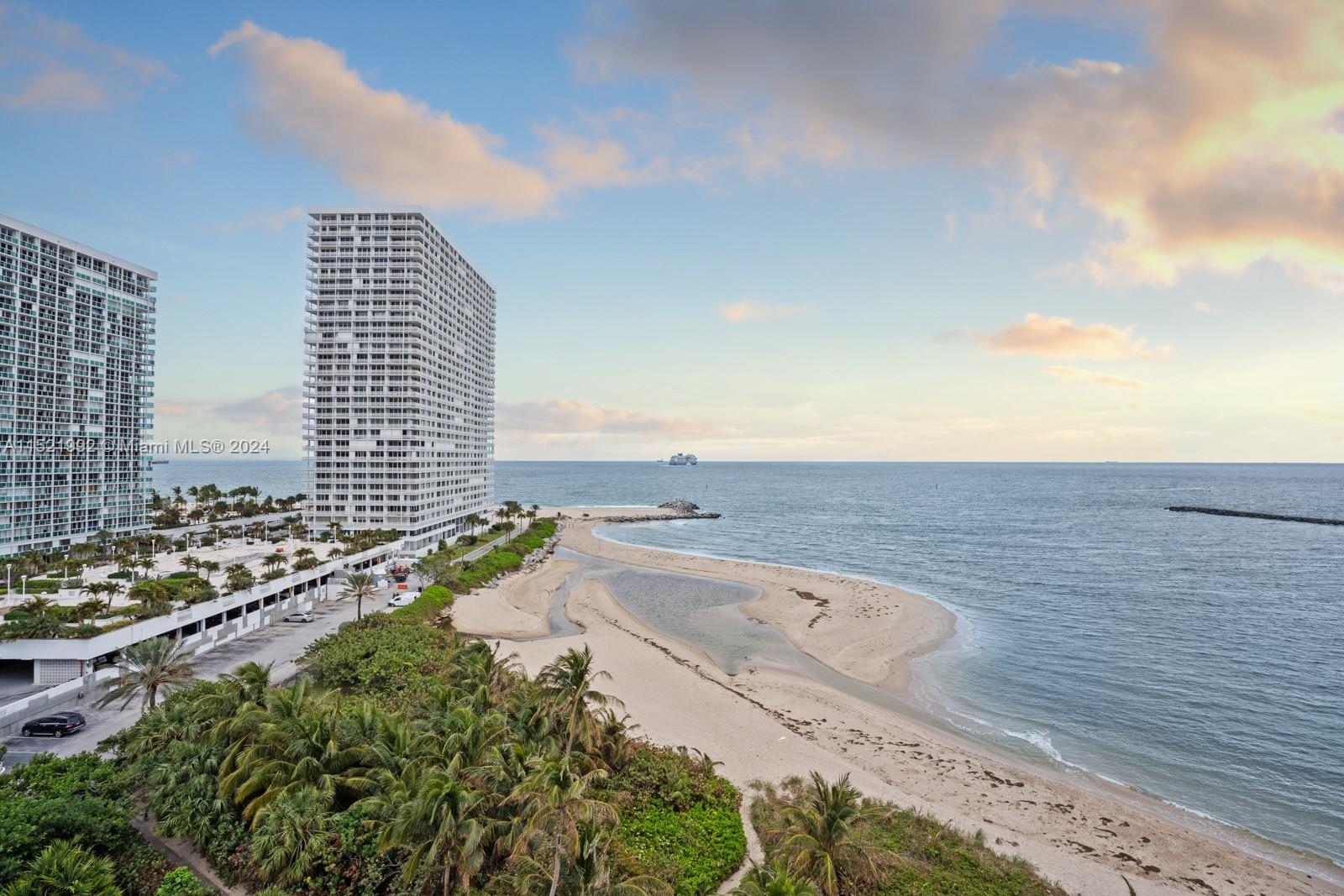 Turnkey furnished short term rental INCLUDES ALL UTILITIES READY FOR IMMEDIATE MOVE IN. Bright Modern Fully Remodeled Direct Ocean View from open 2/2 corner residence. Euro Style kitchen with new custom cabinetry, sleek finishes, quartz counter tops, stainless steel appliances, open floor plan, and formal dining room. Private balcony over looking where the ocean meets the port, watch the cruise ships go by, impact windows and doors throughout, large bedrooms, remodeled bathrooms, ample closet space. Zoned for A- Rated Harbordale. 
Resort style amenities including Pool overlooking the Port, private beach access, community putting green, bbq, community room, party room, gym, all overlooking the water.
