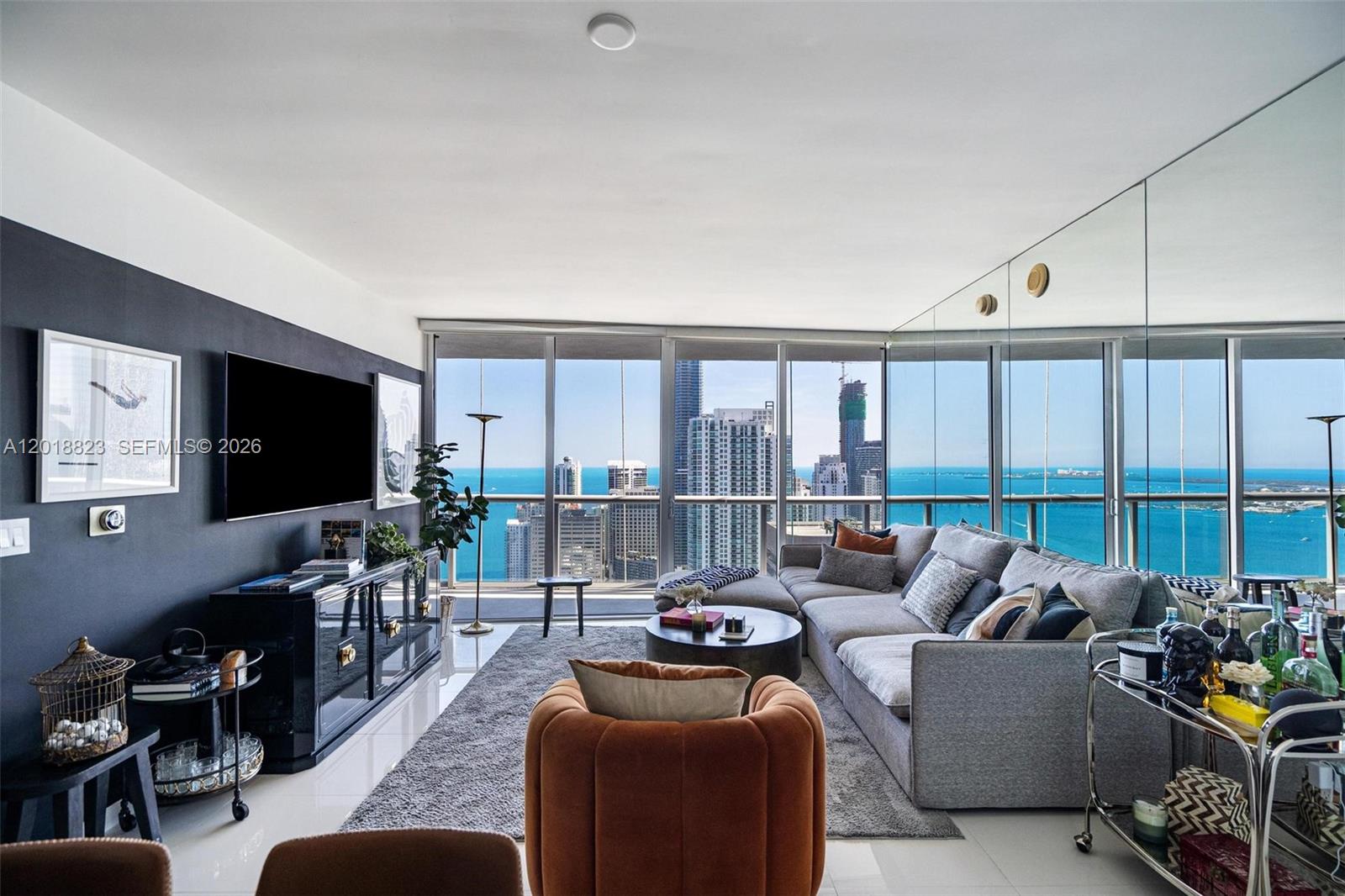 Experience elevated living in the sky at residence 4911 in the iconic Icon Brickell — a spectacular 2-bedroom, 2-bathroom luxury residence in the heart of Miami’s most vibrant waterfront neighborhood. Perched on a high floor, this sophisticated unit showcases breathtaking panoramic views of Biscayne Bay, the Miami River, and the glittering Miami skyline through dramatic floor-to-ceiling windows.

This beautifully designed residence features a spacious open-concept floor plan filled with natural light, sleek contemporary finishes, and seamless indoor-outdoor living. The gourmet kitchen is equipped with premium stainless steel appliances, European-style cabinetry, and elegant stone countertops, flowing effortlessly into the living and dining areas — perfect for entertaining or enjoying Miami’s luxury lifestyle.
The expansive primary suite offers a spa-inspired bathroom, generous closet space, and stunning water and city views, while the second bedroom and bath provide comfort and privacy for guests or a home office setup.
Residents of Icon Brickell enjoy world-class amenities including a resort-style pool overlooking Biscayne Bay, state-of-the-art fitness center, luxurious spa, concierge, valet, and access to premier dining and entertainment. Located steps from Brickell City Centre, top restaurants, nightlife, and the Miami waterfront, this residence offers the ultimate urban luxury experience.