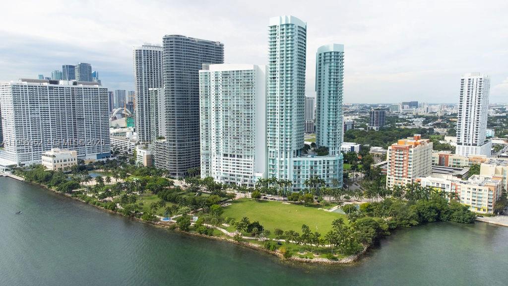 Experience breathtaking living in this 2-bed, 2.5-bath condo at Quantum on the Bay! This modern unit offers a wraparound balcony with water views and downtown sunsets. The primary bedroom features its own balcony overlooking the water. Located in a vibrant area with Margaret Pace Park right in front, you’re just minutes from Miami Beach and the Design District. The open layout feels like home, with a modern kitchen, in-unit laundry, and spacious closets. Built in 2008, the full-service building offers a gym, pool, theater room, and more. Walk to shops, dining, and the Kaseya Center—Miami living at its finest!