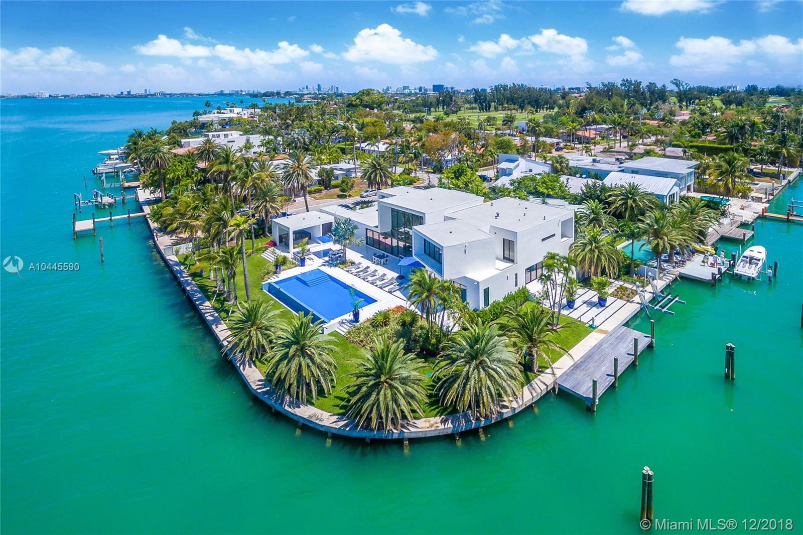 With 300 feet of unobstructed OPEN BAY this Architectural Dream Home has one of the best layouts in Miami Beach. Ready to Move in and never listed before, this Masterpiece is truly a one of a kind property. Located inside the gated community of Normandy Golf Course Island, this house has been uniquely designed to answer to the needs of the most discerning homeowner. With an oversize Waterfront corner lot configuration, you will have the possibility to dock your yacht on the side, so you can enjoy the unbelievable sunset views of the bay from your infinity pool. You can also decide to entertain your friends at the outdoor kitchen of the private pool cabana. Let's not forget the spectacular 24ft floor-to-ceiling windows, the Ornare tailor-made kitchen/closets & the floating glass staircases.