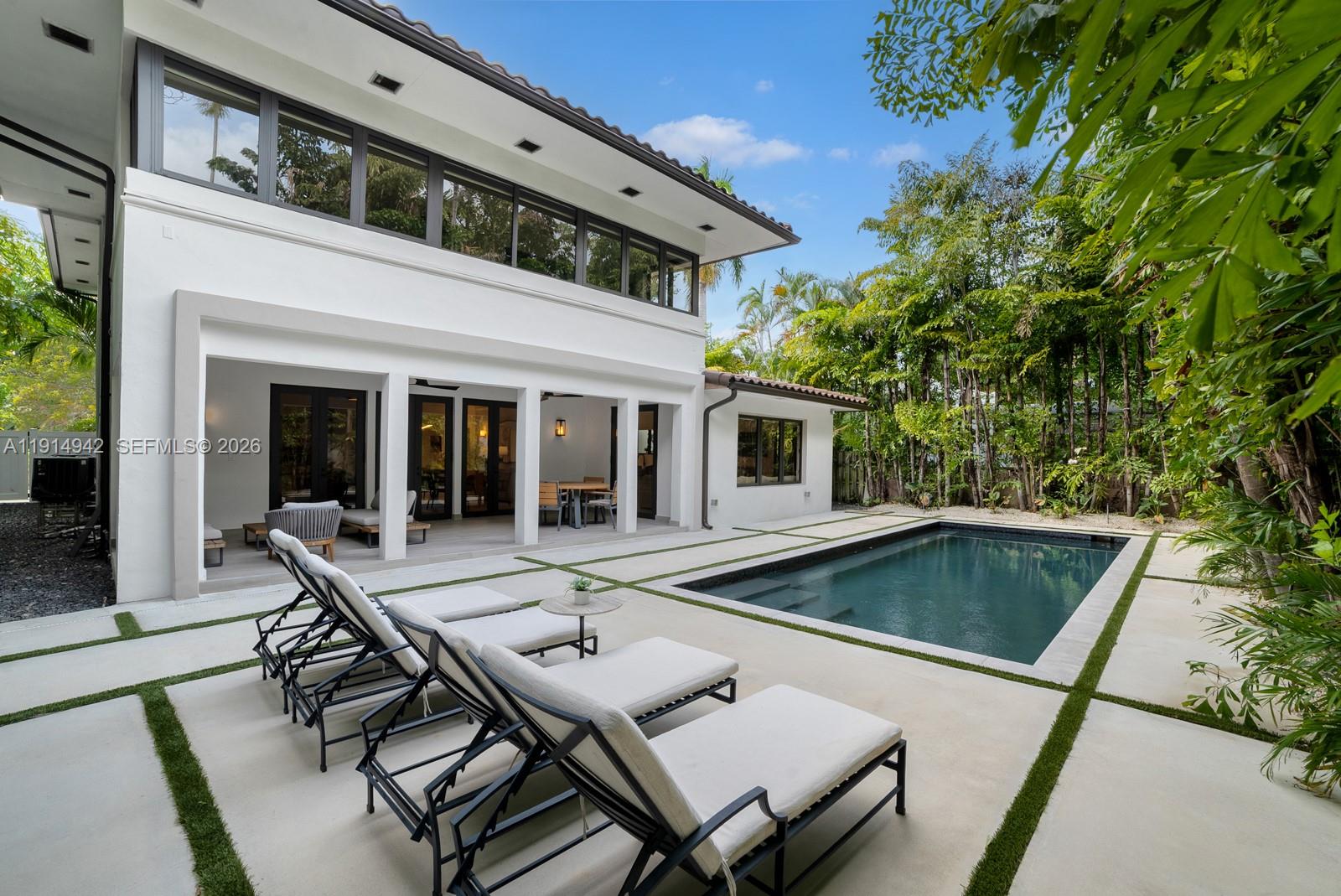 Discover this charming Spanish Mediterranean estate nestled in the ultra-exclusive Upper North Bay Road Estate section. This fully renovated 5-bed, 5-bath home offers 4,000+ SF of living space on an impressive 8,345 SF lot. Behind the gates lies a spacious driveway and a 2-car air-conditioned garage. The chef’s kitchen anchors the home alongside formal living and den areas. Step outside to a covered loggia and heated pool, framed by lush, ultra-private landscaping. The palatial primary suite boasts a walk-in closet and spa-like bathroom, while generously sized guest bedrooms provide comfort for all. Just one block from La Gorce Country Club and minutes to Sunset Harbour, Bal Harbour, & all major causeways. Live on Miami Beach’s most coveted street, surrounded by estates valued over $150M.