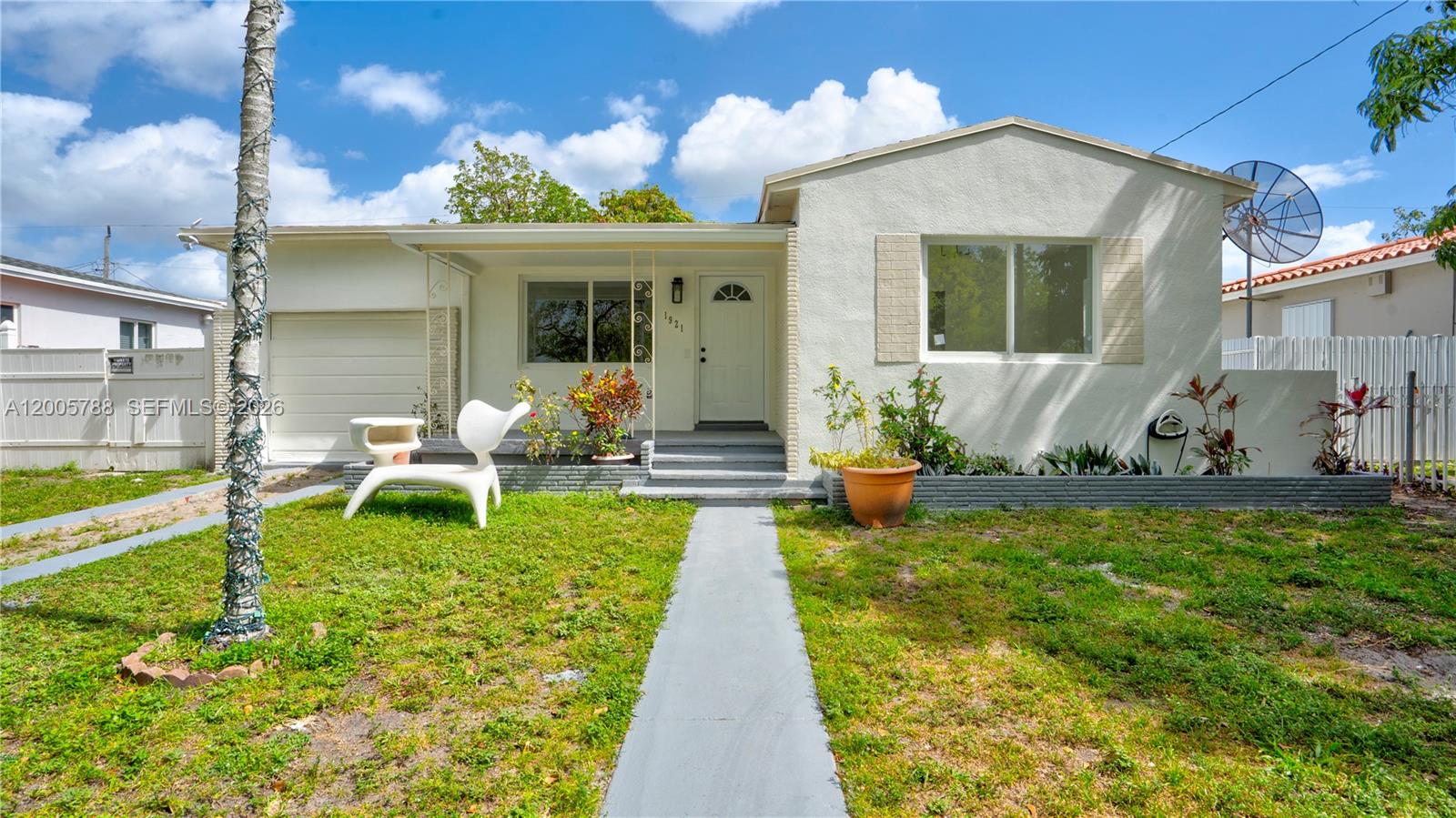 Turnkey North Miami Beach gem—fully reimagined and move-in ready. This stylish 3-bedroom, 2-bath residence offers approximately 1,110 square feet of bright, modern living space with a one-car garage. Every detail has been upgraded, featuring brand-new flooring throughout, a sleek contemporary kitchen with a spacious island, and all-new stainless steel appliances .

The generously sized primary suite delivers a private retreat with an en-suite bath and a walk-in closet. Both bathrooms have been thoughtfully renovated with sleek finishes, beautiful walk-in showers and modern vanities.
The home is equipped with a brand-new A/C compressor for optimal comfort year-round, a 2021 roof (approximately 5 years old), and impact windows for added security, efficiency, and peace of mind.

Set on a quiet, family-friendly street lined with mature trees, the neighborhood offers a unique charm—where peacocks roam freely, creating a serene, nature-inspired backdrop.

 Ideally positioned less than 3 miles from Oleta River State Park and the beach, this home also places you moments from everyday essentials—grocery stores, dining, and retail. Outdoor enthusiasts will appreciate being under half a mile from the Snake Creek Canal trail, perfect for biking, jogging, walking, and enjoying nearby playgrounds and fitness spaces.

A rare opportunity to own a fully updated home in a peaceful yet conveniently connected pocket of North Miami Beach.