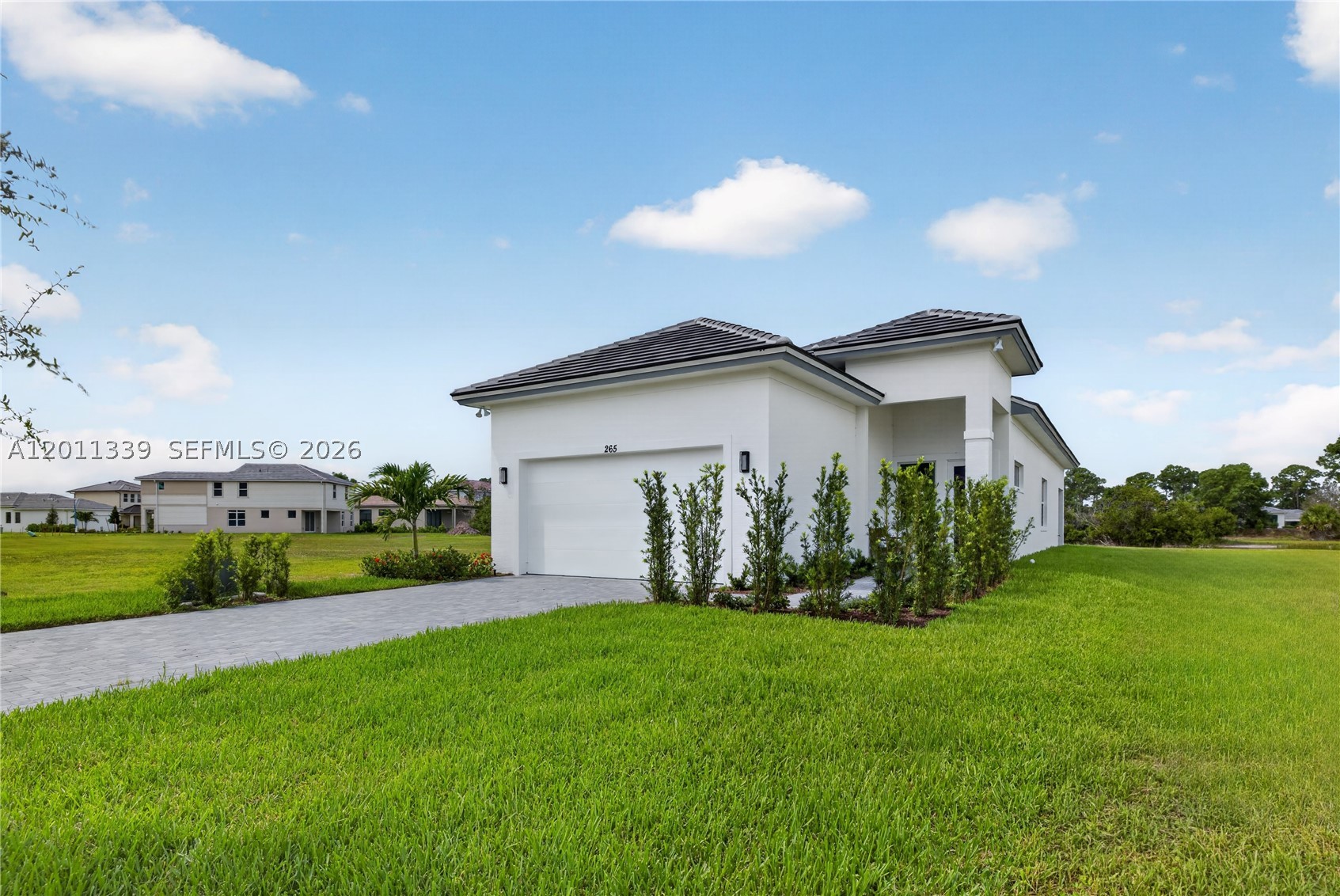 Welcome Home to a bright and airy home perfectly situated on a private preserve with long lake views. This 3-bedroom, 2-bathroom gem combines modern luxury with serene natural surroundings. Home Features:
Open-concept living with soaring 11' ceilings and natural light throughout. Gourmet kitchen with 42" cabinets, quartz countertops, natural electric cooktop, and all appliances included. Hurricane impact windows for safety and peace of mind. Wood-look tile in main living areas and throughout  for a warm, contemporary feel. Covered patio perfect for relaxing or entertaining.
Community Amenities:
Boutique community of approximately 317 homes
Tennis courts, fitness center, and swimming pool
Prime location: 15-18 minutes to Downtown Stuart and Jensen Beach, 20-25 minutes to beautiful beaches
Experience the perfect blend of modern comfort, privacy, and convenience in Rivella – a community designed for those who appreciate quality and lifestyle.
