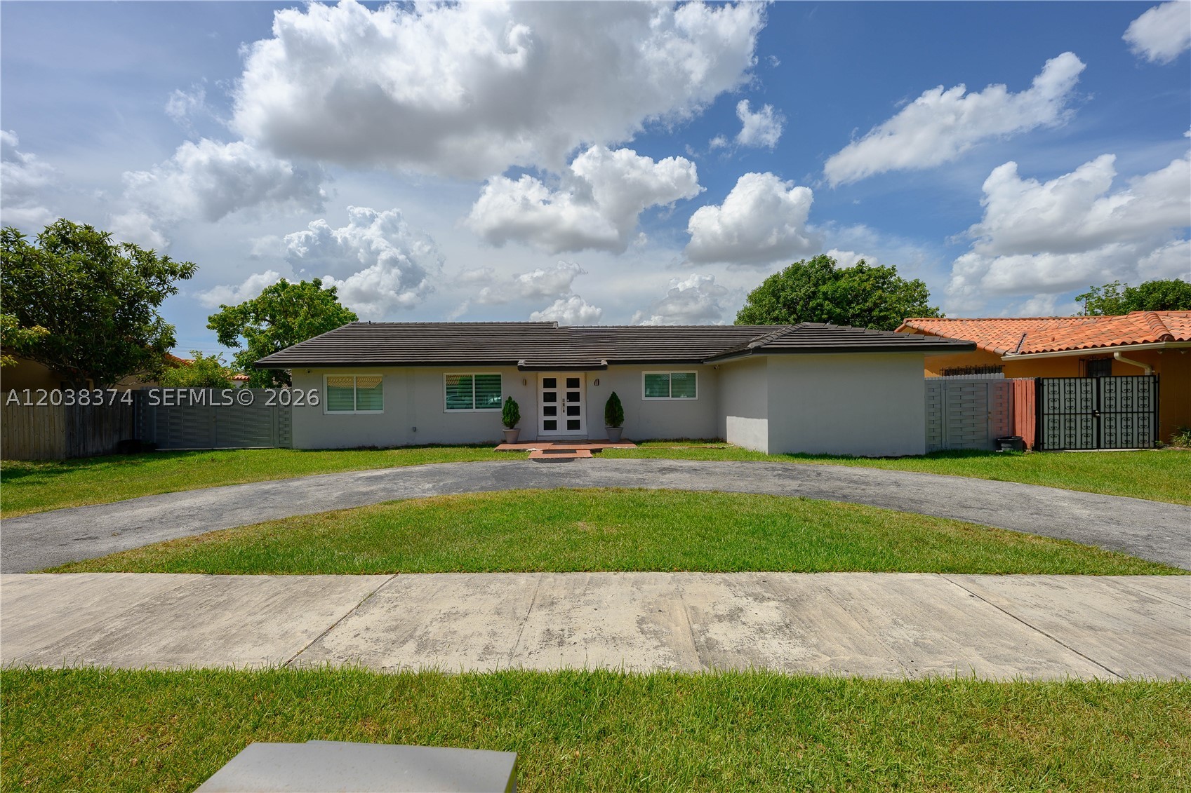 Beautifully updated 4-bedroom, 2-bath pool home in a prime location. Renovated in 2020, this move-in-ready home features a tile roof and impact windows and doors installed in 2022, PVC plumbing, tile flooring throughout, an updated kitchen with ample cabinetry and generous counter space, and beautifully renovated bathrooms. A bright, open layout filled with natural light creates a warm and inviting atmosphere. The functional floor plan opens seamlessly to the main living areas, making it ideal for both everyday living and entertaining. Outside, enjoy your private backyard retreat with a sparkling pool, updated pool deck and tile surround, new fencing, and plenty of space to relax or host family and friends. Additional highlights include a circular driveway for ample parking and excellent curb appeal. Conveniently located near FIU, the Dolphin Expressway, Florida Turnpike, shopping, dining, and entertainment, this home offers the perfect combination of modern updates, comfort, and convenience.