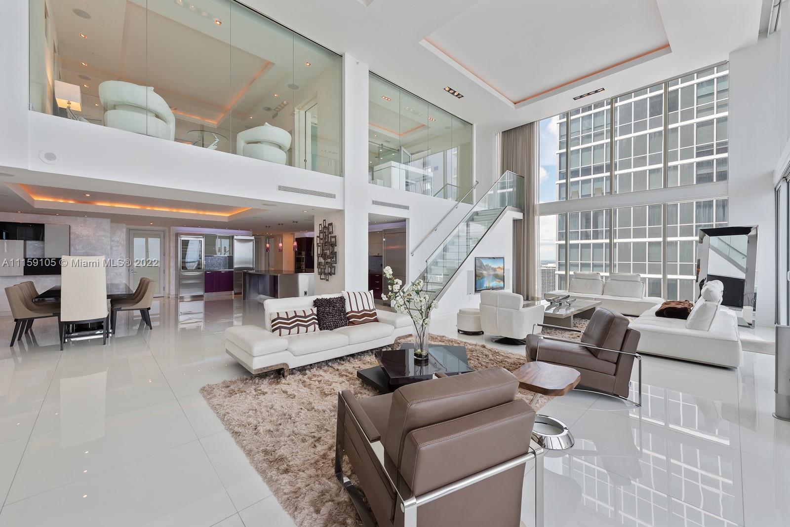 Exquisite tri-level, custom built, lower penthouse that boasts the finest details through-out, with breathtaking picturesque bay, city and ocean views! This 4 bedroom 5.5 baths is 4450sf (PER CONDO ASSOCIATION)) 1749sf exterior, with 20FT soaring ceilings with expansive walls of glass! Architect/design by EcoTek (Jan Stanbury) Opustone white porcelain floors 3x3 tiles, La Finestra metal & glass doors, Moduhome Italian closets, summer kitchen with private pool and patio on the third floor. This fabulous home in the sky, is located in the Ten Museum Park, a boutique building with a world renowned spa, with 5-star service: 24-hr concierge, valet, full service gym, wave pool, yoga, cycling, steam room/spa with massage available.