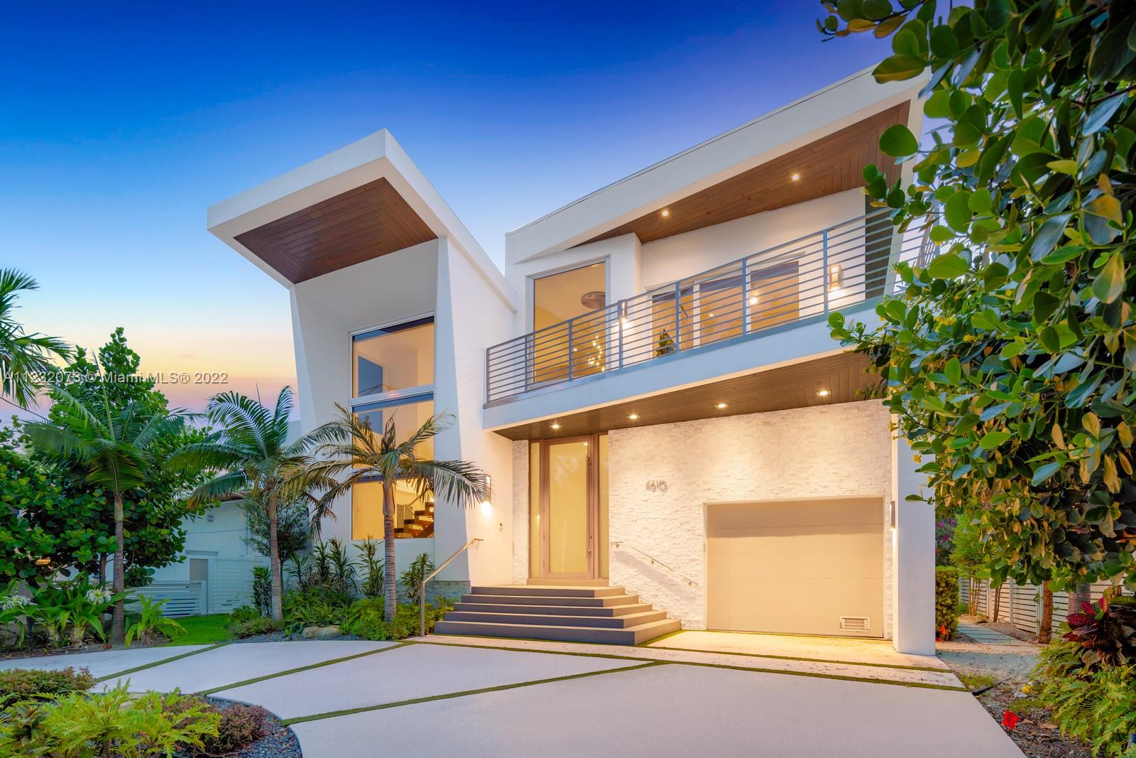 Sophisticated contemporary elegance awaits in Miami Beach's finest smart home being offered fully furnished turn-key. A recently constructed home with over 5000 sqft of indoor/outdoor space, this is an entertainer’s masterpiece featuring two living/entertainment areas, each equipped with a kitchen, suited for hosting guests and family. Curated with top of the line finishes and interior design, Meile appliances, custom artistic glass and steel staircase, dramatic chandelier, media/game lounge with wet bar, exotic acrylic glass spa/heated pool with automated water and ambient lighting features, you are sure to make the most memorable impressions. Open each of the living room areas completely for a true indoor-outdoor lifestyle as you make your way to the incredible 3rd level private rooftop