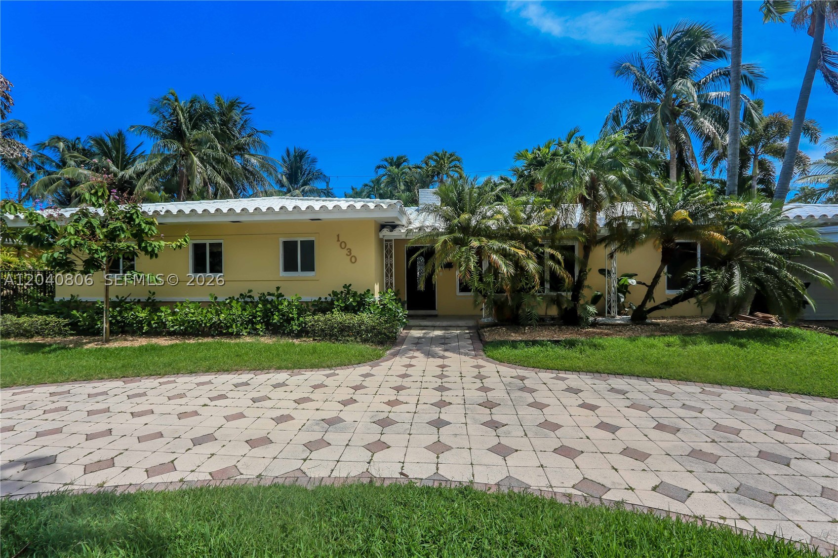 Discover the best of South Florida living in this beautifully maintained 3-bedroom, 2.5-bath pool home nestled in the highly sought-after Hollywood Lakes neighborhood. Set on an oversized lot with outstanding curb appeal, this residence offers an exceptional combination of spacious interiors and resort-style outdoor amenities. Designed for both everyday comfort and effortless entertaining, the home features a bright, open-concept layout with expansive windows that fill the living spaces with natural light. The generous primary suite serves as a peaceful retreat, complete with a stunning, fully renovated en-suite bathroom, while the secondary full bath has also been thoughtfully updated with modern finishes. Step outside and experience your own private oasis. The expansive covered patio overlooks a sparkling heated pool and spa, creating the perfect setting for year-round enjoyment. A built-in grill makes outdoor dining and hosting a breeze, while the large backyard provides ample space for recreation, celebrations, or simply relaxing in the Florida sunshine. Ideally located within walking distance of the neighborhood’s parks, golf course, and all that Hollywood Lakes has to offer, this exceptional property combines timeless charm, modern updates, and the lifestyle you've been waiting for.