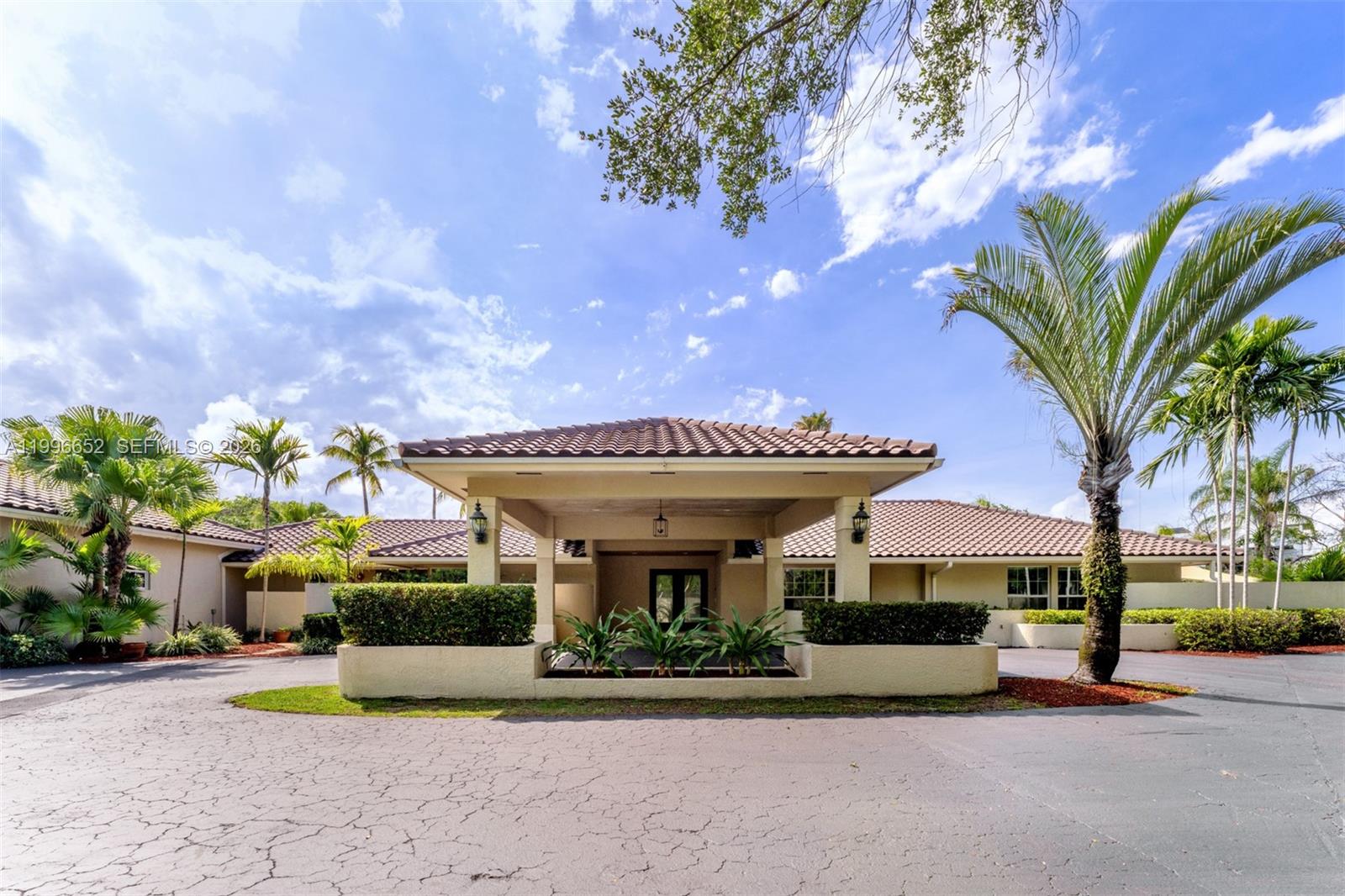 Rare opportunity in an ideal Palmetto Bay location! Situated on a sprawling 37,897 SF canal-front corner lot, this 6-bedroom, 4-bath residence offers endless potential to create your dream estate. Tucked away on a quiet street, the property features expansive grounds with ample space to park boats, RVs, and additional vehicles. The home offers two separate entertainment areas, a charming working fireplace, and a covered summer kitchen area overlooking the backyard and canal. Whether you choose to renovate and reimagine the existing residence or start fresh with a brand-new custom home, the lot, location, and setting make this a truly special offering. Surrounded by lush greenery and estate-style homes, this property is ideal for buyers seeking privacy, space, and exceptional potential in one of South Florida’s most desirable neighborhoods.
