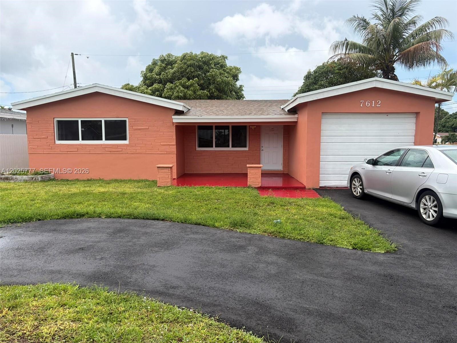Welcome to this charming home located at 7612 Plantation Blvd in Hollywood, FL. This delightful residence has 3 Bedrooms, 2 full Baths and 1 Car Garage. All the appliances are new and stainless steel, new Washer/Dryer. New roof was installed in April, 2026.  All Windows & Doors are Hurricane Impact, inspected and Passed on May 20,2026. New water proof floors with decorative walls and new quartz kitchen counter top. Enjoy the open living areas, appropriate for entertaining guests. The property includes a well-maintained yard for outdoor activities. Conveniently located near shopping, dining, and entertainment options, this home provides an excellent opportunity to experience everything the area has to accord.
