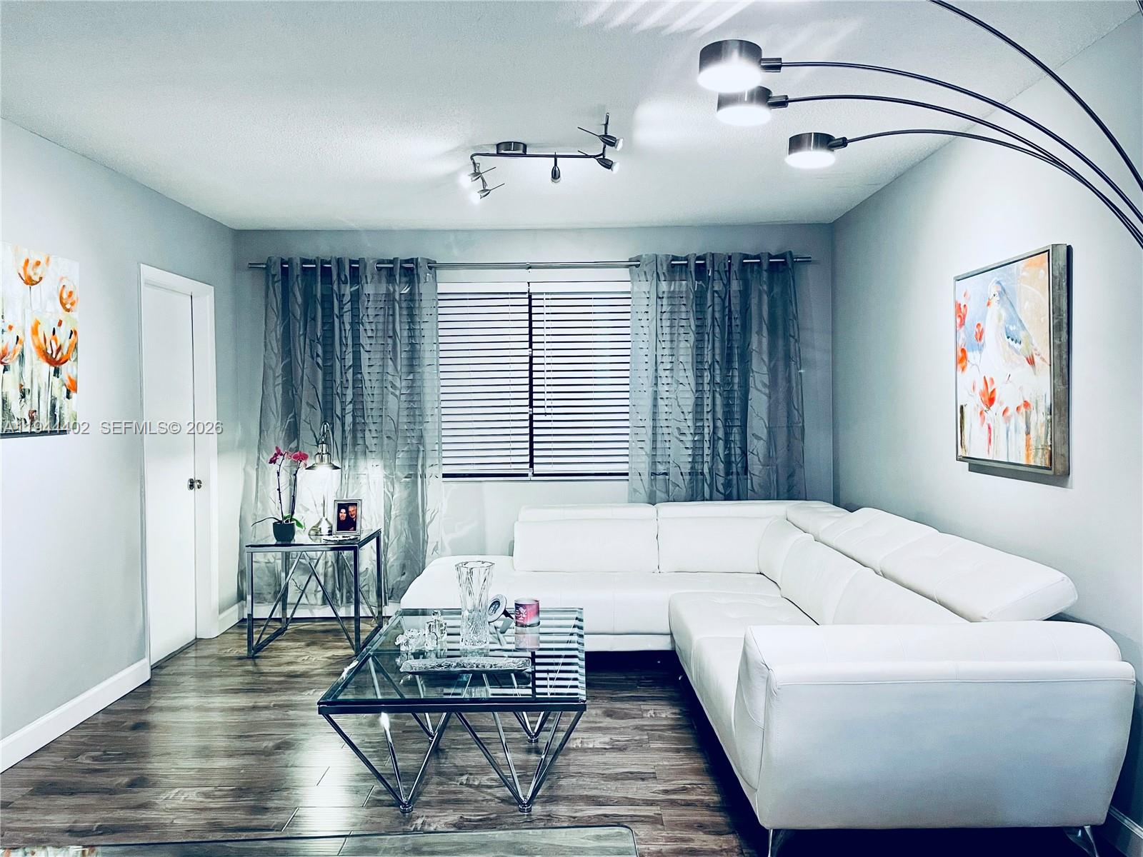 Contemporary and updated 2 bedrooms and 2 full bathrooms corner unit in Hollywood Hills. Newer white quartz kitchen countertops and wooden white shaker cabinets. Located at Sheridan Lakes, across from T.Y. Park, and conveniently located near to shopping centers, the beaches and Fort Lauderdale International Airport. Many amenities in the community to enjoy such as fully equipped community pool, barbecue area, exercise room, library and more. Laundry facilities in each floor. 55+ COMMUNITY (at least one occupant has to be 55 and minors older than 16). Seller is motivated. Application with the HOA.