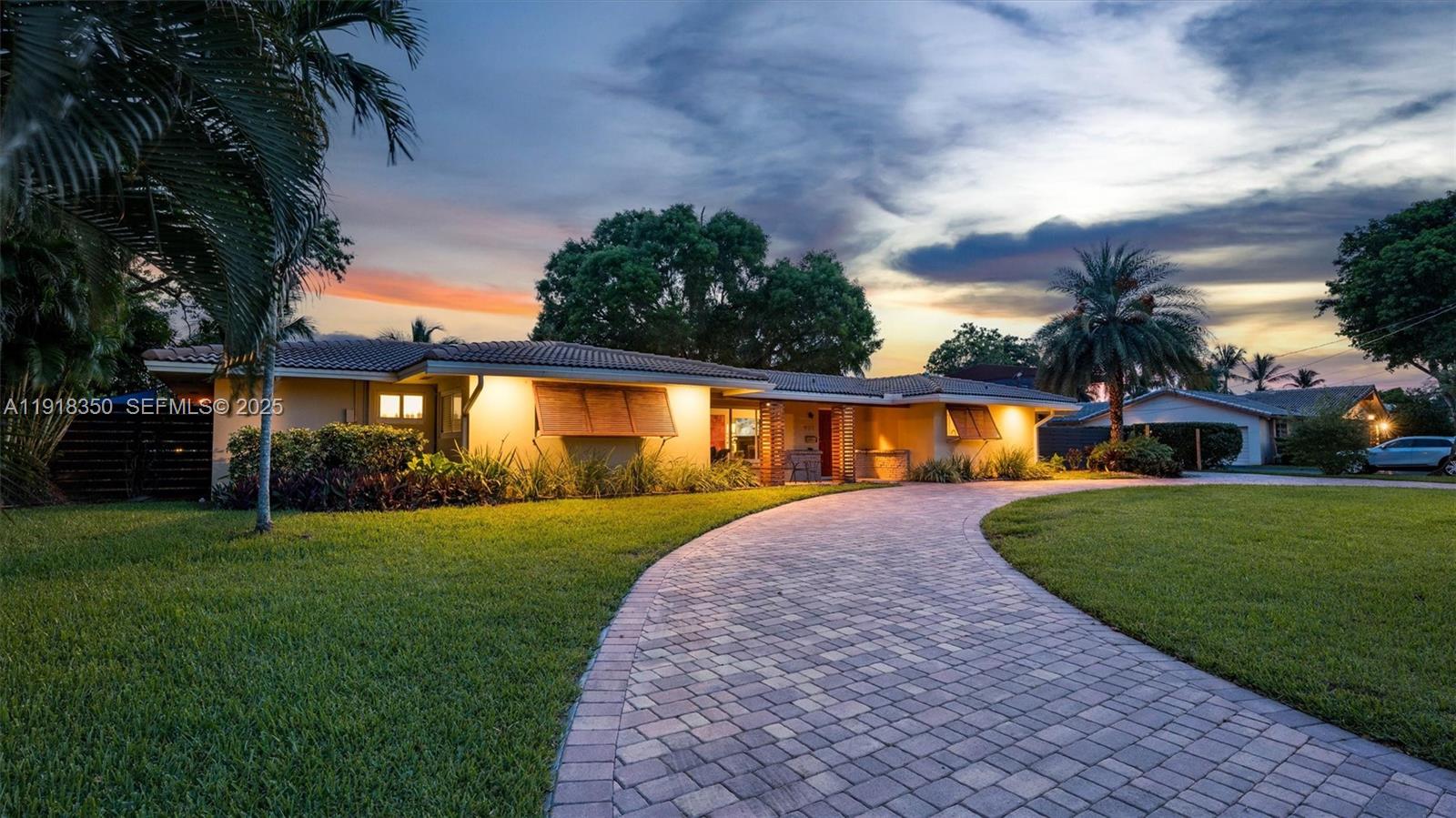 NEW & IMPROVED PRICE – BEST VALUE IN THE NEIGHBORHOOD! Fall in love with this stylish waterfront gem in Plantation Golf Estates. Set on an oversized canal-front lot, this remodeled home blends charm with modern flair. The show-stopping kitchen features quartz waterfall counters, smart appliances, a farmhouse sink, and open shelving. Epoxy floors, impact windows and doors, and a sleek fireplace elevate the vibe. The split layout offers a serene primary suite with walk-in closet, dual vanities, and a den/office. No HOA, RV/boat parking, room for a future pool, plus golf, parks, and top-rated schools nearby. This is the one—perfect for entertaining or upgrading your lifestyle.