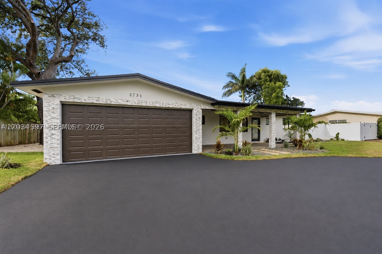Beautifully renovated 3-bedroom, 2-bath home in the highly desirable Lighthouse Point community. This move-in-ready residence showcases quality upgrades throughout, including a NEW 2026 roof, updated electrical system, impact windows and doors, new attic insulation, and a new sprinkler system on well water. The bright and open floor plan is enhanced by abundant natural light and modern finishes, creating a welcoming atmosphere for everyday living and entertaining.

The updated kitchen features new appliances, while the home also includes a new washer and dryer for added convenience. The spacious primary suite and generously sized guest bedrooms provide comfort and flexibility. An oversized two-car garage boasts a new garage door and durable epoxy flooring, offering plenty of space for vehicles, storage, or a workshop.

Step outside to a generously sized backyard with ample room to add a pool and create your own private outdoor oasis. Conveniently located near beaches, marinas, shopping, dining, and all that Lighthouse Point has to offer, this exceptional home combines modern upgrades, functionality, and South Florida living at its finest.