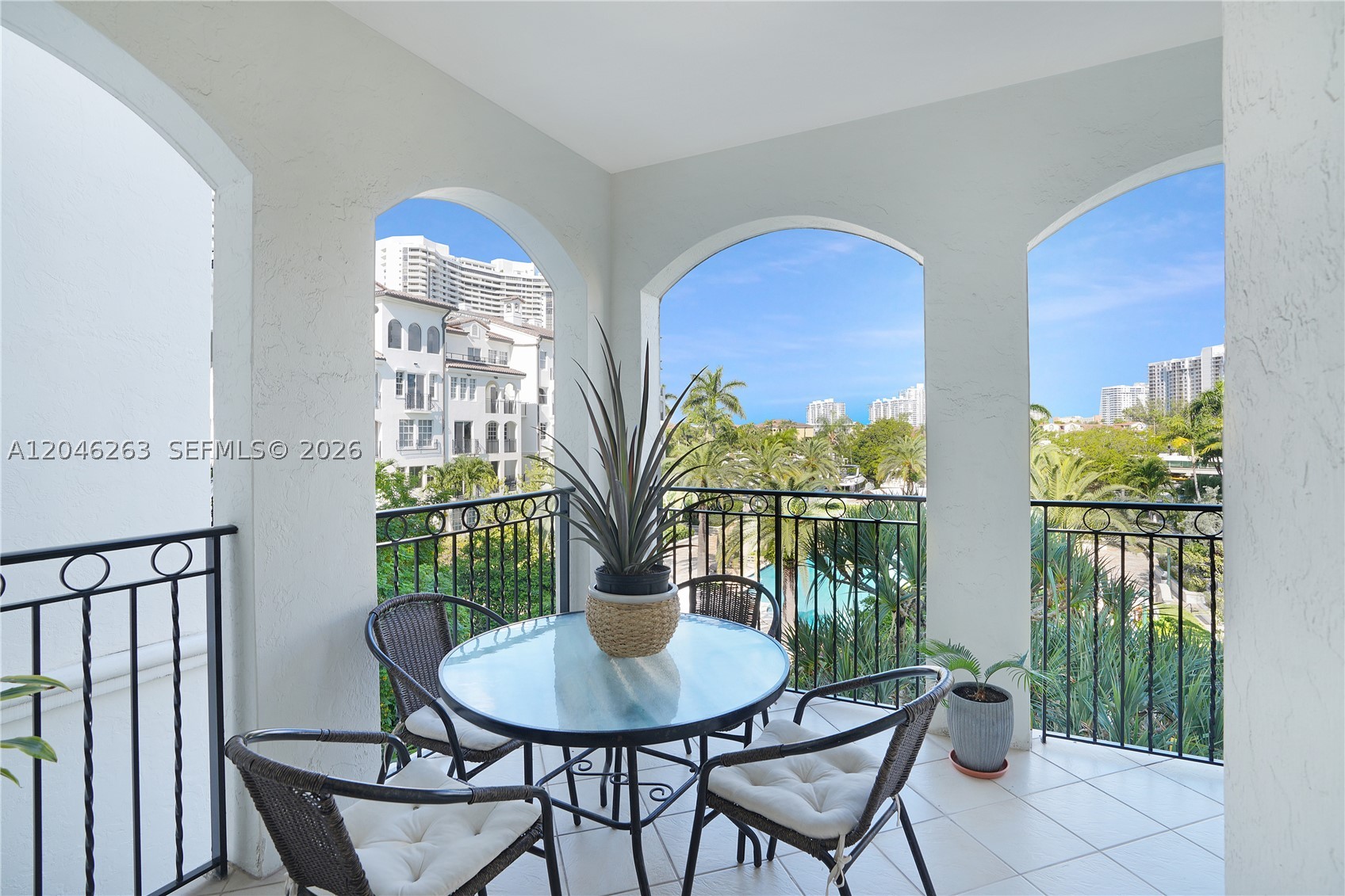 NEWLY RENOVATED BATHROOMS: Enjoy your best life here...This 3rd-floor 3BR/2BA unit in Mediterranean Village boasts water views of the pool and marina, 3 balconies, Recently Updated Bathrooms, Quartz Countertops, Impact Windows and Doors, AC Unit, Washer-Dryer, and Flooring. Your private elevator accesses only 2 units per floor. Gated community offers resort-style amenities: 16 Tennis Courts, Designer Pool, Health Spa, 3 Restaurants, Hair Salon, Kids Playground, Dog Park, Walk/Jog path and a Deep Water Marina accommodating super yachts. Additional perks include a Courtesy Bus, 24-hour Security, 1 covered parking space, valet parking for additional vehicles/guests, and storage room - Available Now!