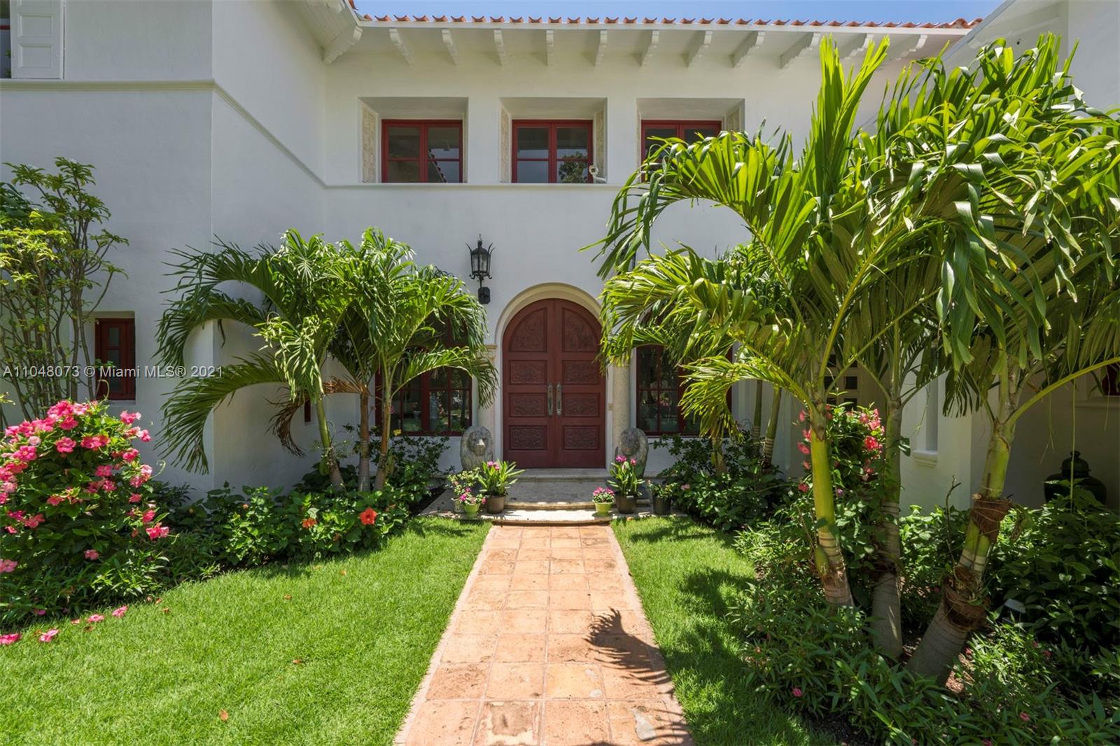 Enjoy living in this exquisite waterfront historic estate on prestigious Pine Tree Dr. A picturesque garden courtyard greets you as you enter this grand 8 BD,6 BA & 2 half bath residence. Large flow-through windows bring in an abundance of natural light w/high ceilings & sparkling views of the bay. 8,578 sqft home features 76 ft of prime waterfrontage, beautiful wood floors & coffered ceilings, an architecturally stunning Victorian spiral staircase w/ soaring ceilings & balconies off the bedrooms overlooking the water. Outdoor area features private dock w/ boat lift & large pool. Brand new roof w/ handmade Spanish tiles, bronze hurricane impact windows/doors, new hurricane impact French doors & elegant new kitchen w/ high end appliances are all in process.