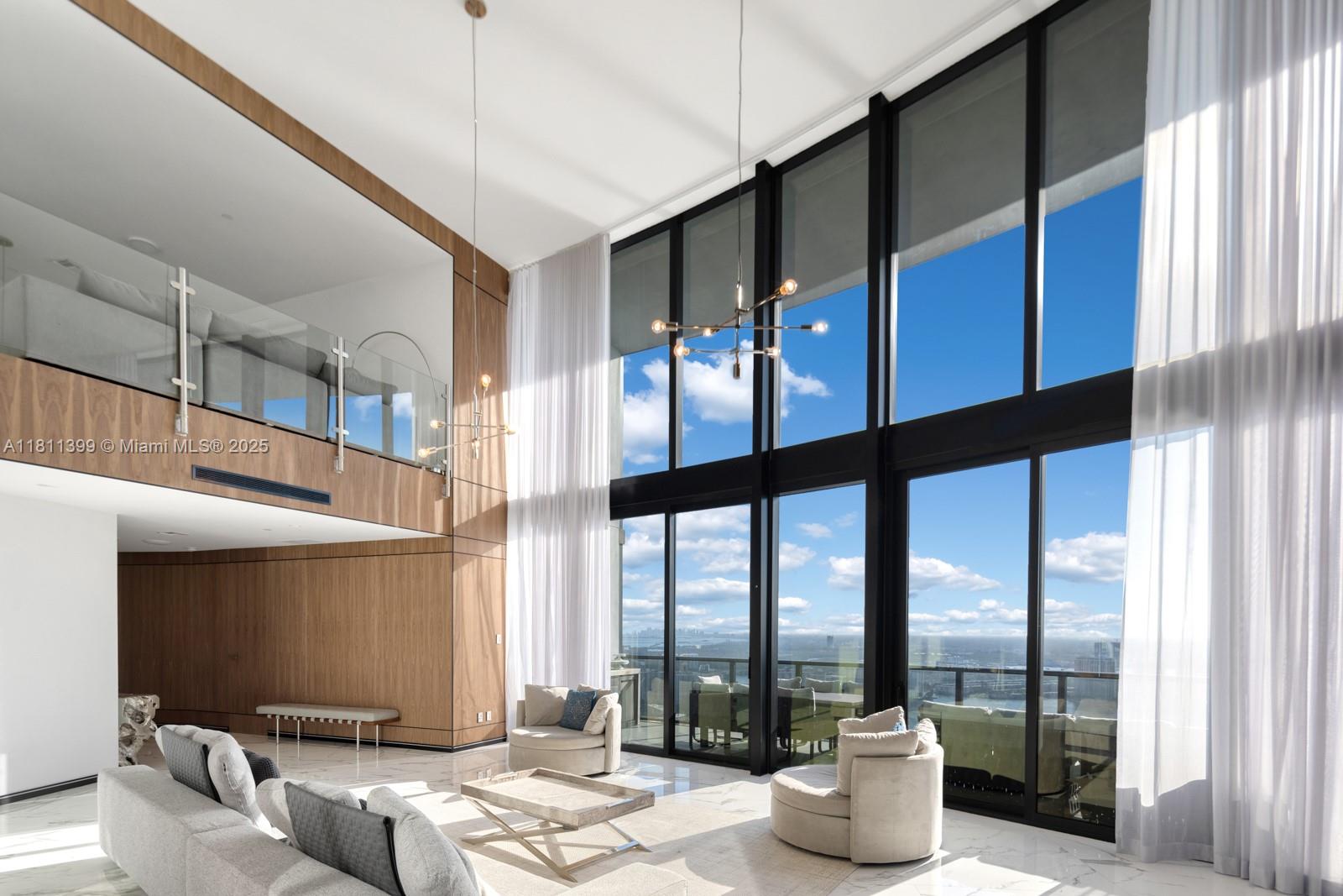 Step into unparalleled luxury at Residence 4603 in the world-renowned Porsche Design Tower. This extraordinary 2-story sky residence features 3 bedrooms, 4.5 baths, soaring 21-foot ceilings, and walls of glass showcasing sweeping views of the Intracoastal, bay, city, and Downtown Miami. Fully furnished with sophisticated style, this home offers the rare feeling of a private estate in the sky. Arrive in ultimate style via your private car elevator to your in-unit garage. Enjoy elite amenities: private restaurant, poolside service, beachfront spa, salon, simulators, theater, and more. This is Miami at its most iconic — luxury redefined at every level.