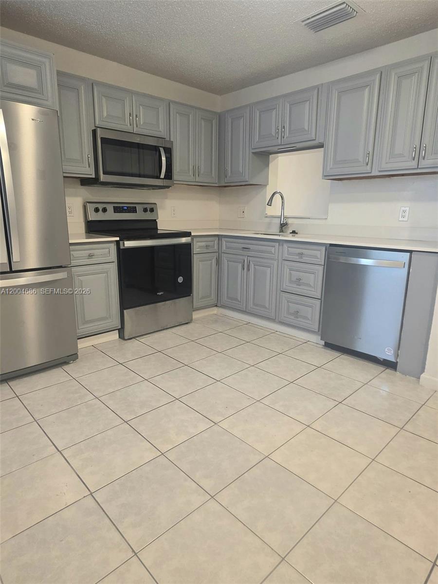 COZZY CONDO LOCATED IN EAGLE VILLAGE. THIS CONDO FEATURES 2 BEDROOMS AND 1.5 BATHROOMS. Move-in-ready!. This stunning 2-bedroom, 1.5-bathroom condo has been beautifully updated. It features a gourmet kitchen with stainless steel appliances and new cabinetry. Relax on your private balcony. Assigned parking. Situated in an unbeatable Coral Springs location, close to The Walk, dining, great schools, and with easy access to major highways. Come see it today!