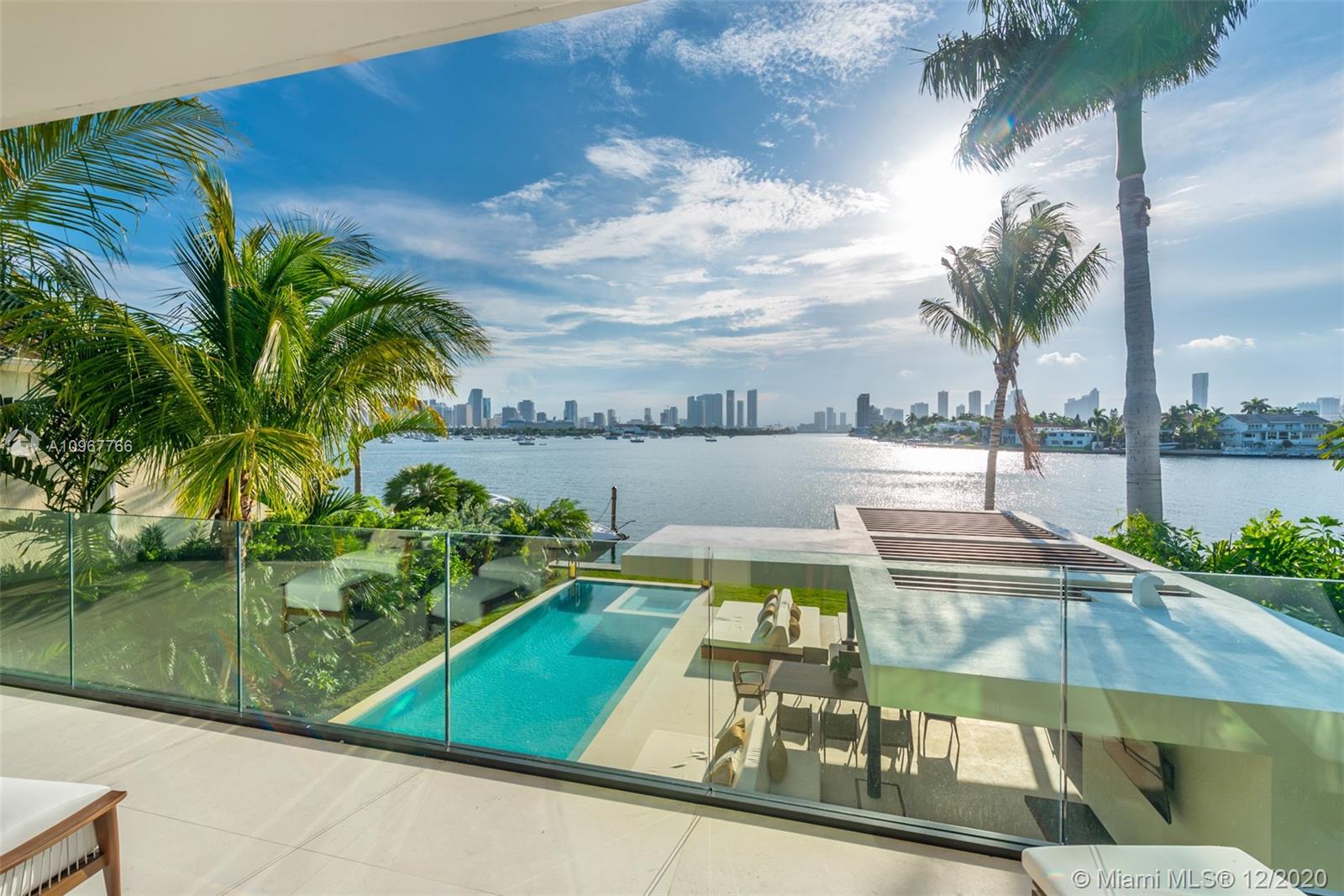 New Construction. Gorgeous 2-story contemporary waterfront home located on the Venetian Islands with incredible views of the Miami downtown skyline, open bay & the most dramatic sunsets in Miami affords an enviable luxury lifestyle in a prestigious, sought-after locale.