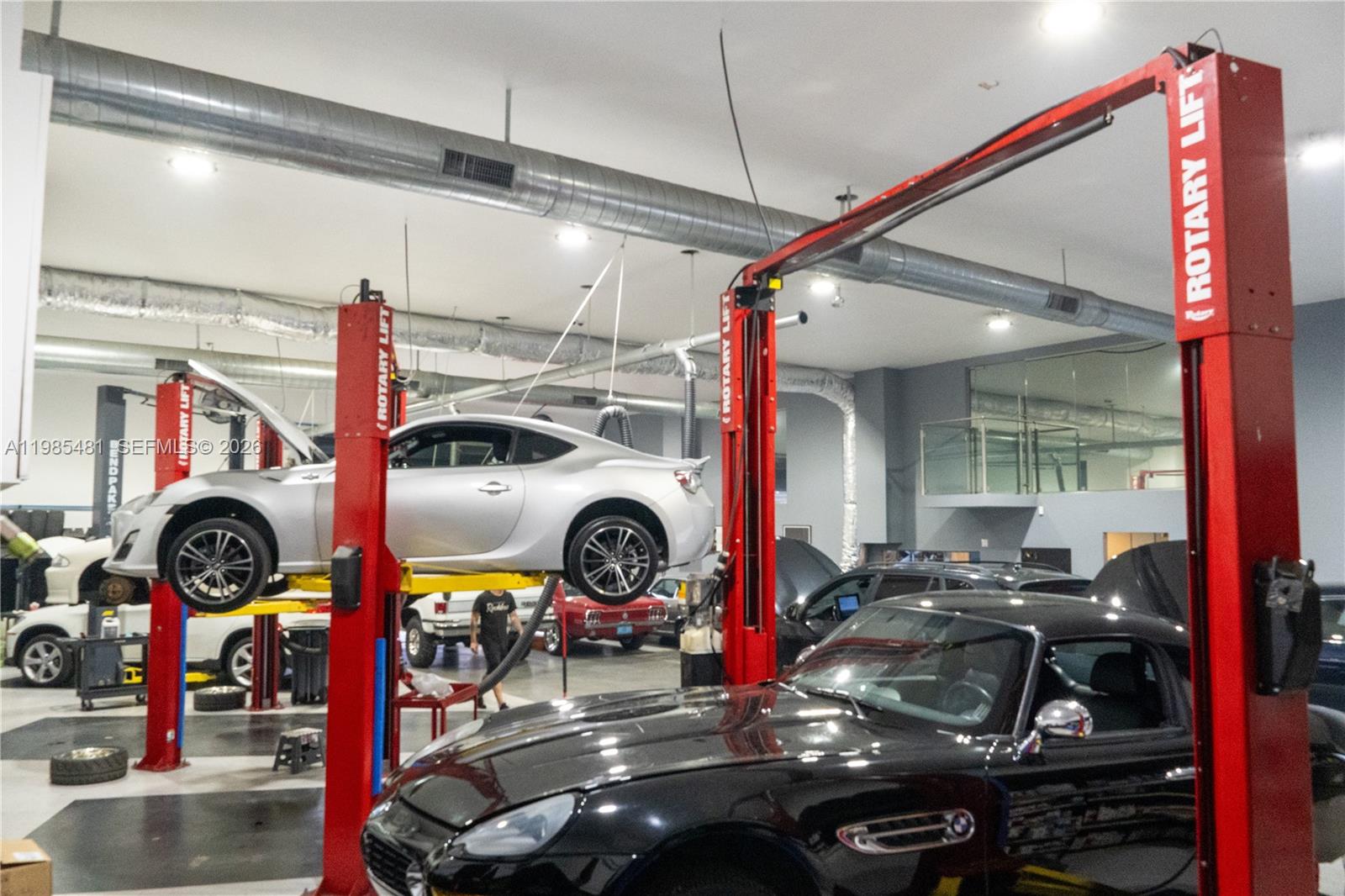 Presenting a rare opportunity to acquire a fully built-out, high-end automotive facility designed for both functionality and lifestyle appeal. This turnkey asset seamlessly blends a professional-grade auto mechanic shop with a refined, “man-cave” style environment—ideal for luxury auto users and boutique operators alike.

The property features ±3,600 SF of fully renovated, air-conditioned interior space, equipped with four professional automotive lifts, two hydraulic roll-up doors, and high-quality finishes throughout. The layout is optimized for efficiency, while maintaining a clean, showroom-style aesthetic suitable for premium automotive use or private collection storage.

Situated on a 10,500 SF secured lot, the property is fully fenced, offering privacy, security, and ample outdoor space for vehicle staging or additional parking.

Investment Highlights:
 • In-place income: Currently leased at with a NNN tenant, providing strong immediate cash flow
 • Turnkey condition: No deferred maintenance; fully operational facility
 • Secure site: Gated and fenced lot with functional yard space
 • Flexible use: Ideal for luxury auto storage, specialty mechanic, detailing, customization, or private enthusiast use