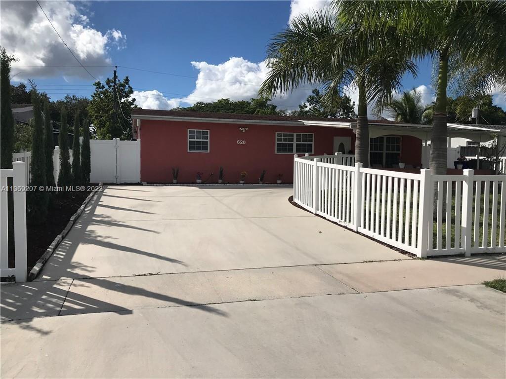 Beautiful spacious 3 bedrooms, 2 full bath. Home is located in a desirable quiet neighborhood without HOA. Open concept living/dining room with separate den or 4th bedroom. Gallery kitchen with plenty of counter space. Tile throughout; ceiling fans in every room. Impact windows, fenced in front and backyard. Oversized driveway with carport. Freshly painted. Separate  laundry room and extra storage. Covered back patio. Close to shopping and easy access to highways.