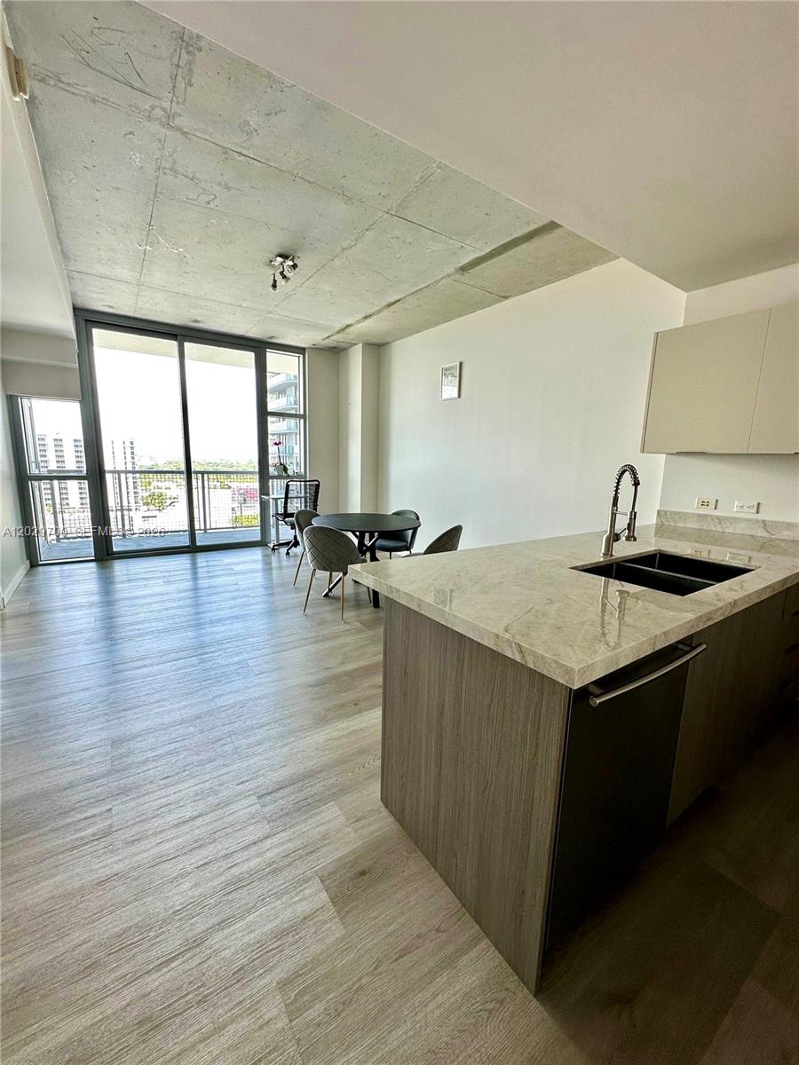 Stunning spacious 1-bed, 1.5-bath modern condo in Midtown Miami. Spectacular city views, floor-to-ceiling windows, brand new floors. Upgraded kitchen with stainless steel appliances, Italian cabinets, white quartz countertops. Master bedroom with huge walk-in closet. Assigned garage parking. 4 Midtown offers top of line amenities like pool, gym, with sauna + steam room, concierge. Close to shopping, dining, Design District, Beaches, downtown, and airport. Unbeatable location with excellent walkability, all of the best shopping and dining within steps! Embrace the vibrant energy of the city from this exceptional residence. Tenant Occupied through 6/30/2026, Perfect for end-user or invester and investor as its soon to be VACANT