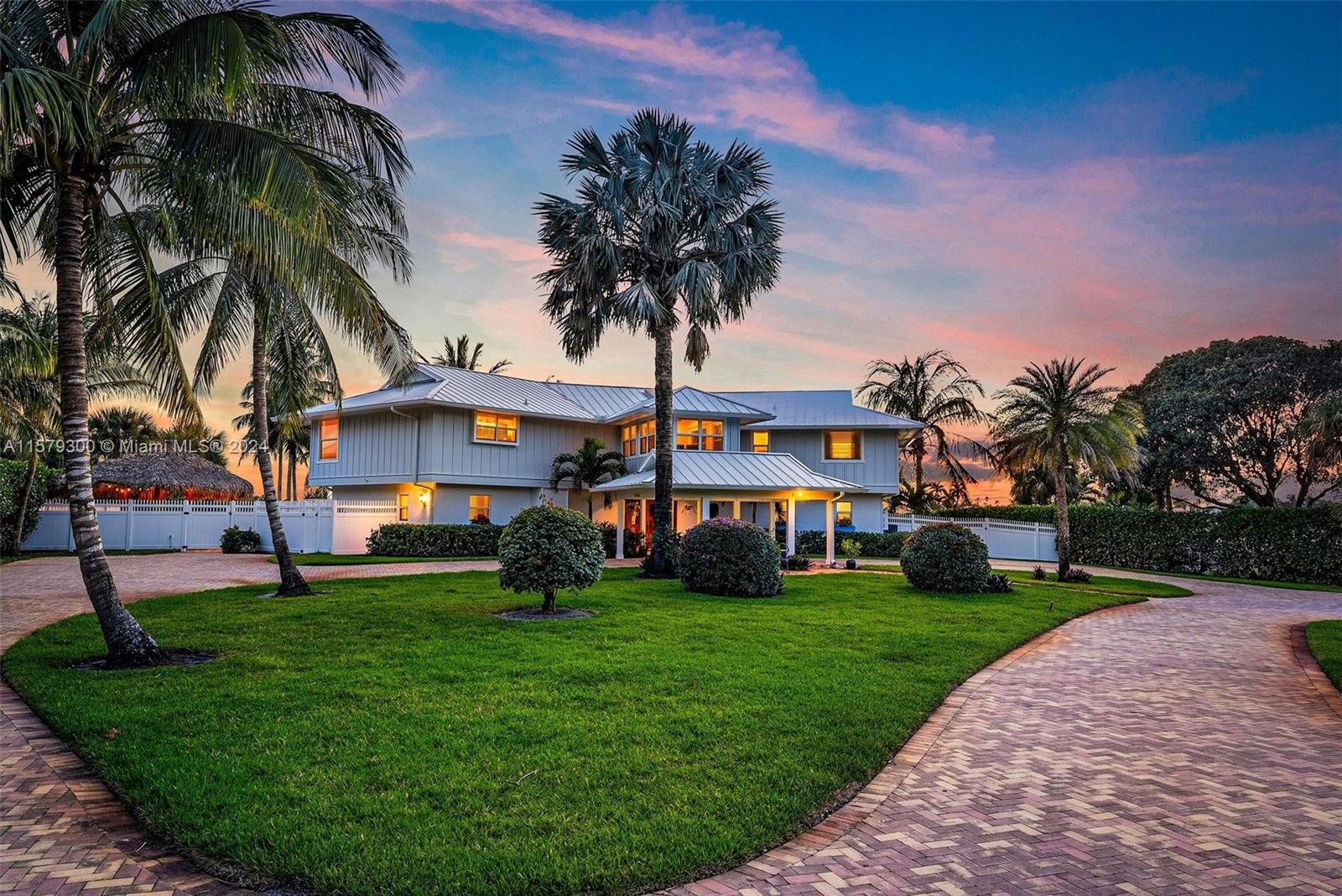 Boater and fisherman's dream, this waterfront paradise located in Rocky Point on the protected Manatee Pocket only minutes from the inlet and downtown Stuart. This 1.08 acre beautifully landscaped property, circular driveway, with 2/1 guest house and detached two car garage.  Newer 6'x180' dock, with electric and water, will accommodate a large yacht plus two lifts, one 20,000 lb. lift and a 12,000 lb. lift. The remodeled main house 4 bedrooms, 6 full baths home with water views from every room, features marble floors downstairs and wood floors upstairs.  Gourmet kitchen with gas cooking, eat in bar, and dining area, on demand hot water heaters.  Outside features pool with spa, surrounded by Old Chicago Brick, Tiki Hut with outdoor kitchen, new fenced yard and beach area by the water.
