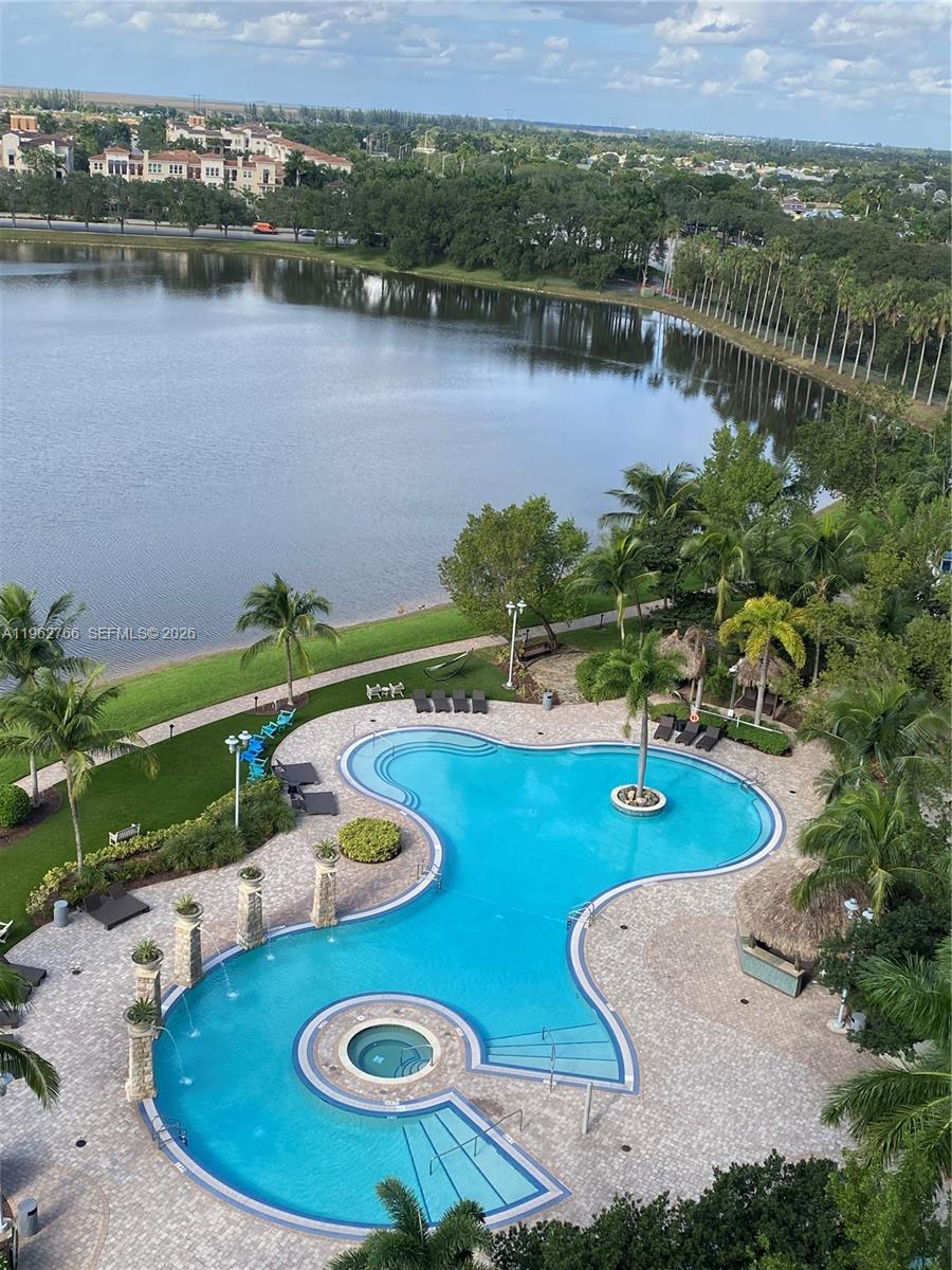 Luxury living 2.5/2 condo at Tao Sawgrass with 2 garage spaces. Stainless steel appliances, granite counters, washer/dryer, and walk-in closets with built-ins. Master bath with Roman tub & double sinks. Open balcony with views of pool, lake & everglades. Luxury building with resort-style amenities including pool, fitness center, spa, tennis courts, business center & 24-hr security. Walking distance to Sawgrass Mills Mall, BB&T Center, fine dining & entertainment. Easy access to I-75, I-595 & Sawgrass Expressway. Perfect for those seeking comfort, convenience & resort-style living in the heart of Sunrise.