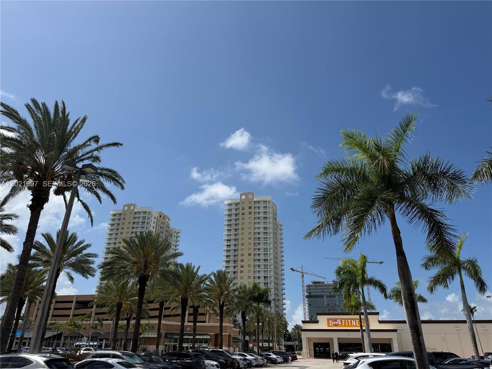 Welcome to Residence 2404 at the Duo Condo East Tower Hallandale Beach This spacious 1 bed, 1.5 bath unit offers a modern open layout and floor-to-ceiling windows that showcase sweeping, unobstructed views of the golf course. Perched on the 24th floor, this bright and airy unit features a well-appointed kitchen with granite countertops, stainless steel appliances, and a convenient breakfast bar. The primary suite includes a large walk-in closet and an ensuite bath, complemented by a guest powder room for added comfort. Designed by renowned architect Kobi Karp and built in 2007.