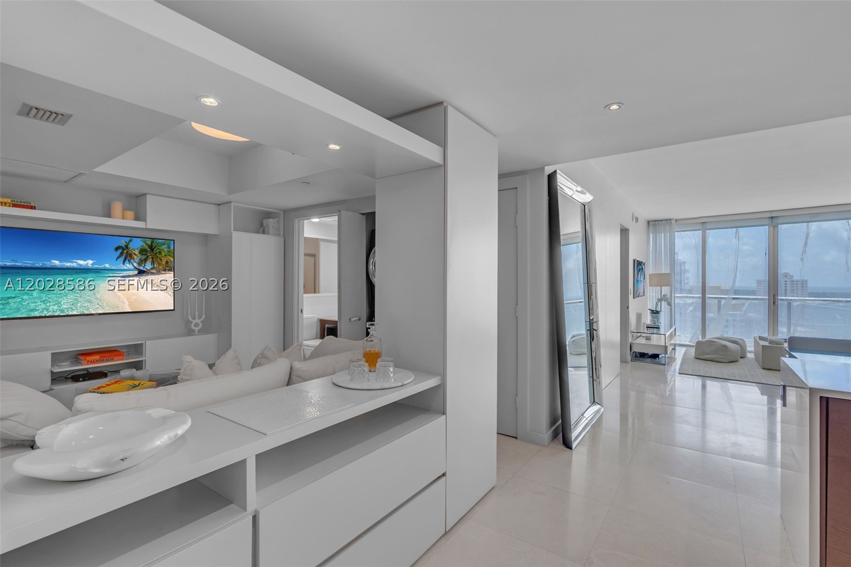 Sophisticated furnished residence at Icon Brickell Tower 1 in the heart of Brickell Miami. This beautifully upgraded 2 bedroom, 2 bathroom + den offers city and water views, abundant natural light, and a refined turnkey living experience. Unlike the standard floor plan, the open den has been enhanced with custom built-in cabinetry, creating a more functional and defined space ideal for a home office, lounge, or flex area. Features include light flooring, floor-to-ceiling impact glass, a custom pantry, premium kitchen appliances, and spacious living and dining areas that open to a private terrace. Offered furnished, this residence is ideal for buyers seeking a move-in ready home, pied-à-terre, or Miami lifestyle residence in one of Brickell’s most iconic waterfront communities. Icon Brickell offers world-class amenities including a resort-style pool deck, spa, fitness center, valet, concierge, on-site dining, and a premier location near Brickell City Centre, Whole Foods, fine dining, shopping, entertainment, Downtown Miami, and the Miami River.