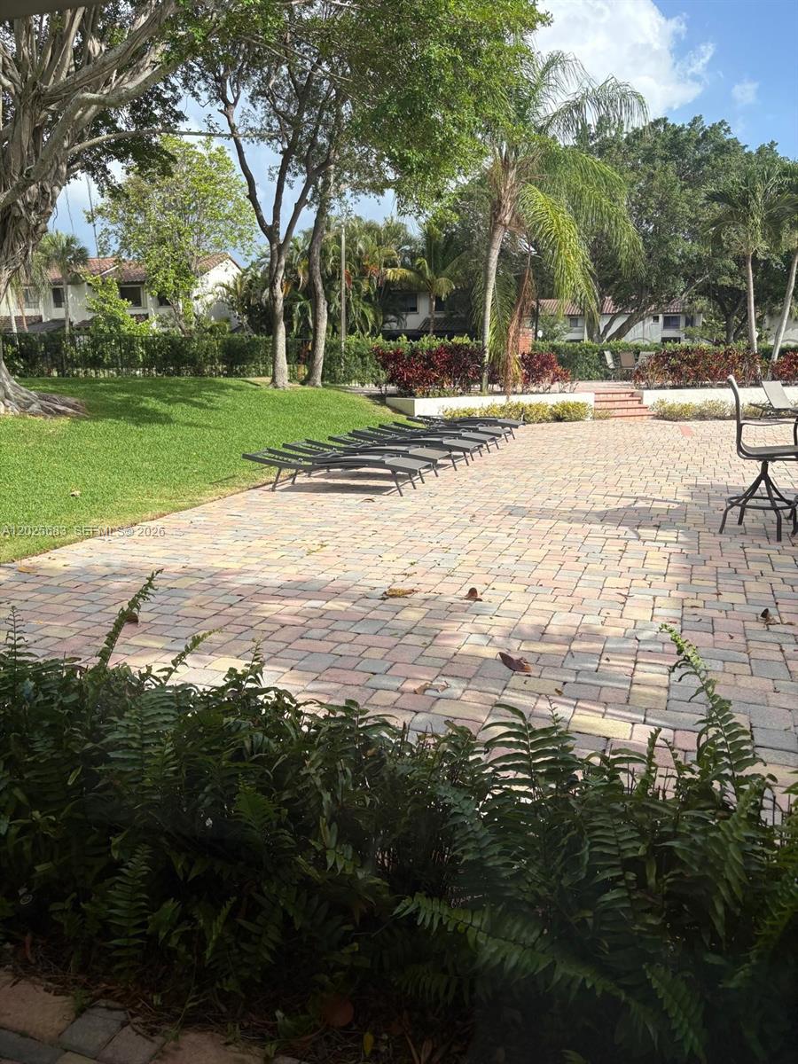 Spacious Townhome  2BR/2BA  in the highly desirable East Boca Raton. This spacious, light-filled home boasts a modern kitchen with elegant granite countertops and stainless steel appliances, beautifully remodeled bathrooms. The community offers top-notch amenities including 2 pools, a fitness center, billiards room, and a picnic area.  plenty of shopping, dining, and entertainment options.