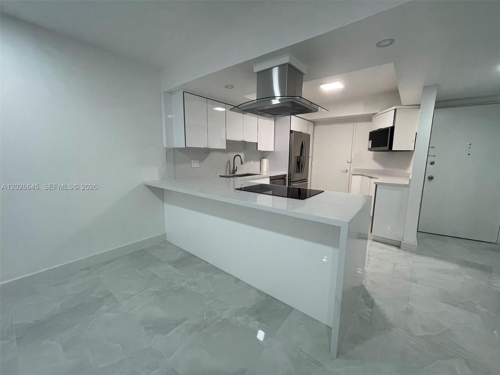 Completely renovated waterfront condo with breathtaking panoramic lake and skyline views from the 12th floor! This bright and spacious 1-bedroom, 2-bath residence features a modern open-concept layout with high-end finishes throughout. Enjoy a designer kitchen with sleek white cabinetry, quartz countertops, stainless steel appliances, glass range hood, cooktop, and contemporary porcelain flooring throughout the entire unit.

The oversized living and dining area offers plenty of natural light and opens to a private balcony overlooking the water and city skyline. Spacious primary suite with ample closet space and beautifully updated bathrooms. Located in the desirable Buckley Towers community with resort-style amenities including pool, secured lobby, and more.

Excellent location near Aventura Mall, beaches, shopping, dining, major highways, and public transportation. Move-in ready and easy to show.

Waterfront living at an affordable price!