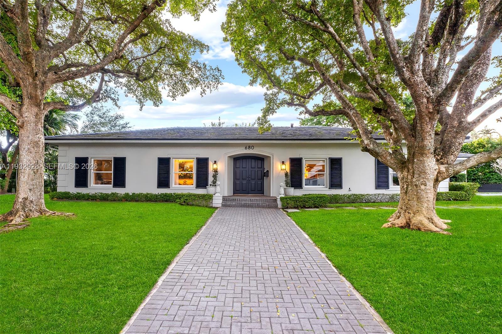 Live well in the highly coveted Bay Point, one of Miami’s most exclusive and private gated communities. This spectacularly renovated residence offers 5 bedrooms, 5.5 bathrooms, and a dedicated office, featuring wood floors, soaring ceilings, and a modern open-concept layout. The home includes formal living and dining rooms, along with a spacious family room ideal for everyday living and entertaining. The primary suite is a true retreat, complete with a private office, sliding doors opening to the backyard garden, and a spa-like bathroom finished in elegant white marble. The modern Italian kitchen showcases stainless steel appliances and a dramatic oversized center island, seamlessly connecting to the main living areas. Ideally located, Bay Point provides easy access to the Design District, Miami Beach, Midtown, and Downtown Miami.